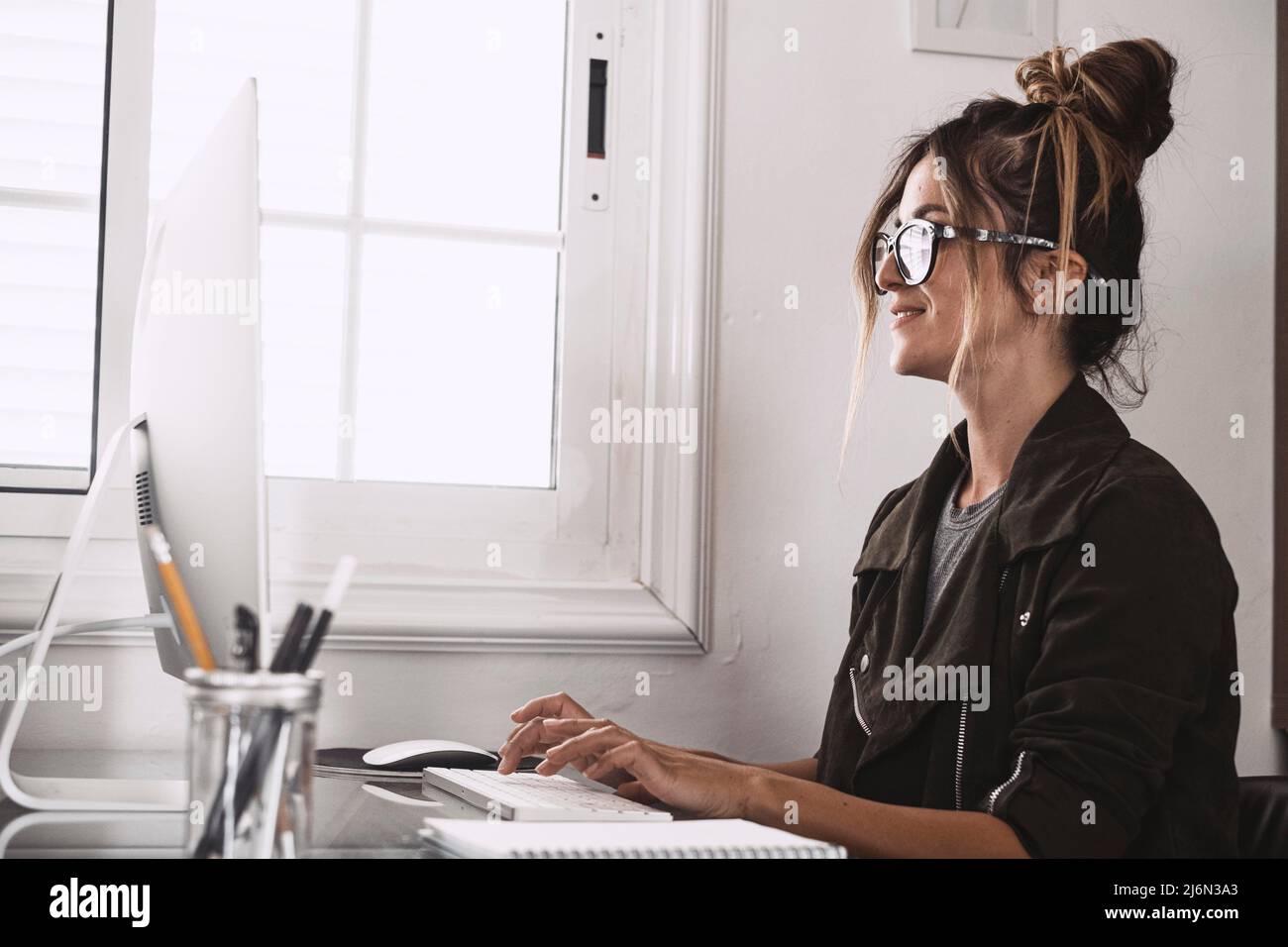 Happy adult young woman in video call conference at home in smart
