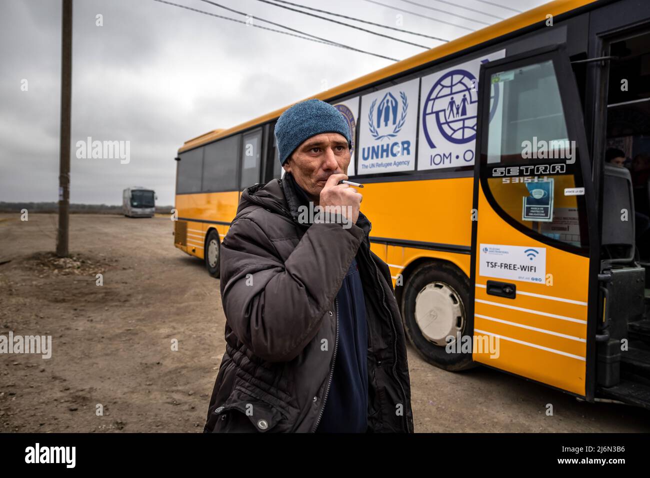 Ukrainian refugees have reached the border with Moldova in Palanka. From here they are taken by small buses to a collection point where they are provided with drinks and food. Coaches then take the refugees to Romania and other European host countries. Stock Photo