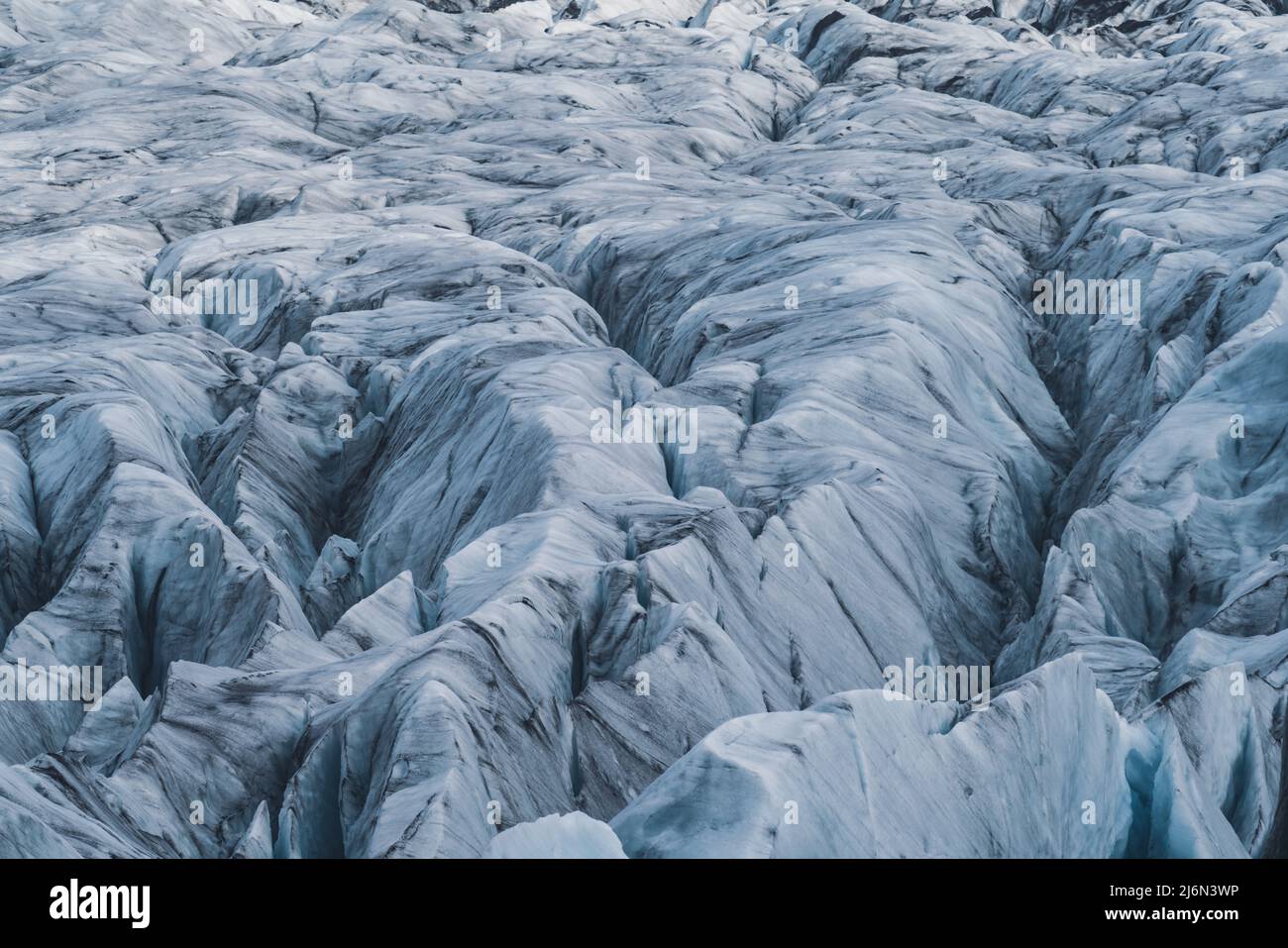 Massive crevassed glacier background, long shot Stock Photo