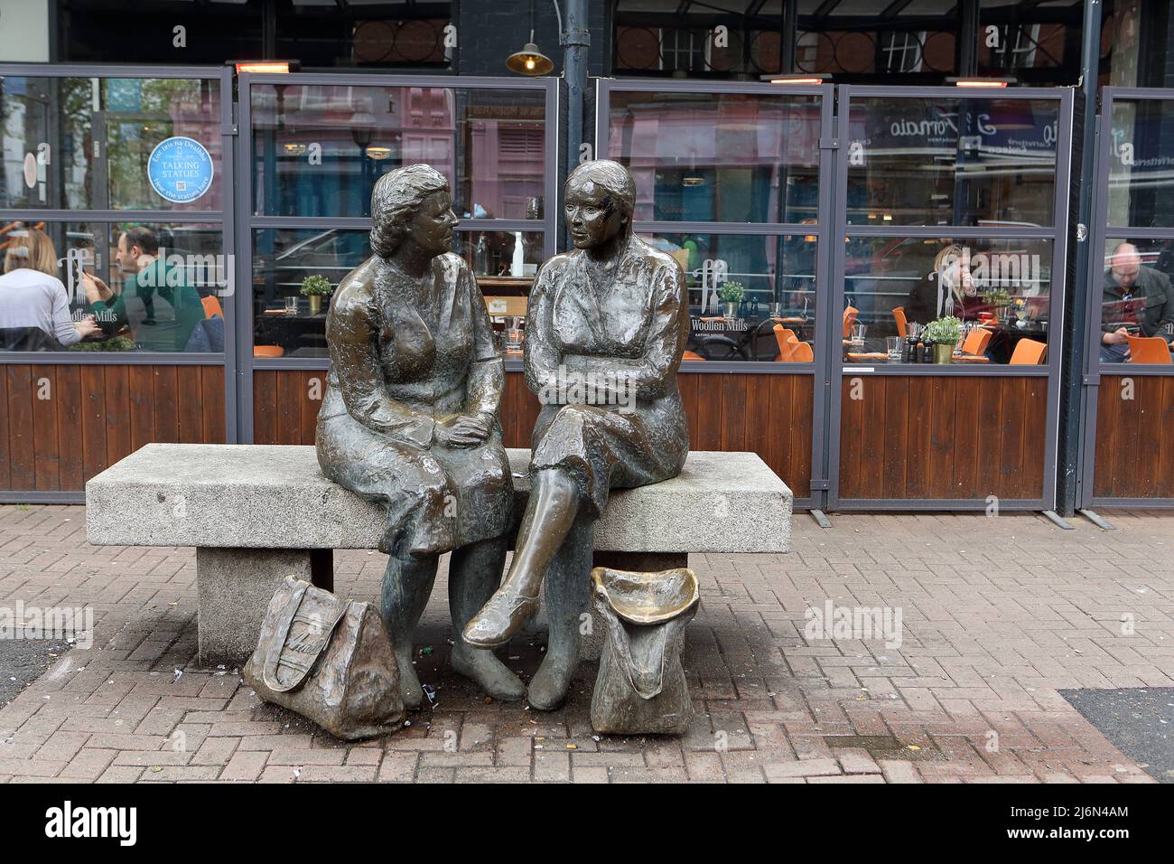 The 'Meeting Place' statue by artist Jackie McKenna, aka 'The Hags with the Bags' situated on lower Liffey street in Dublin by the Ha'penny bridge. Stock Photo