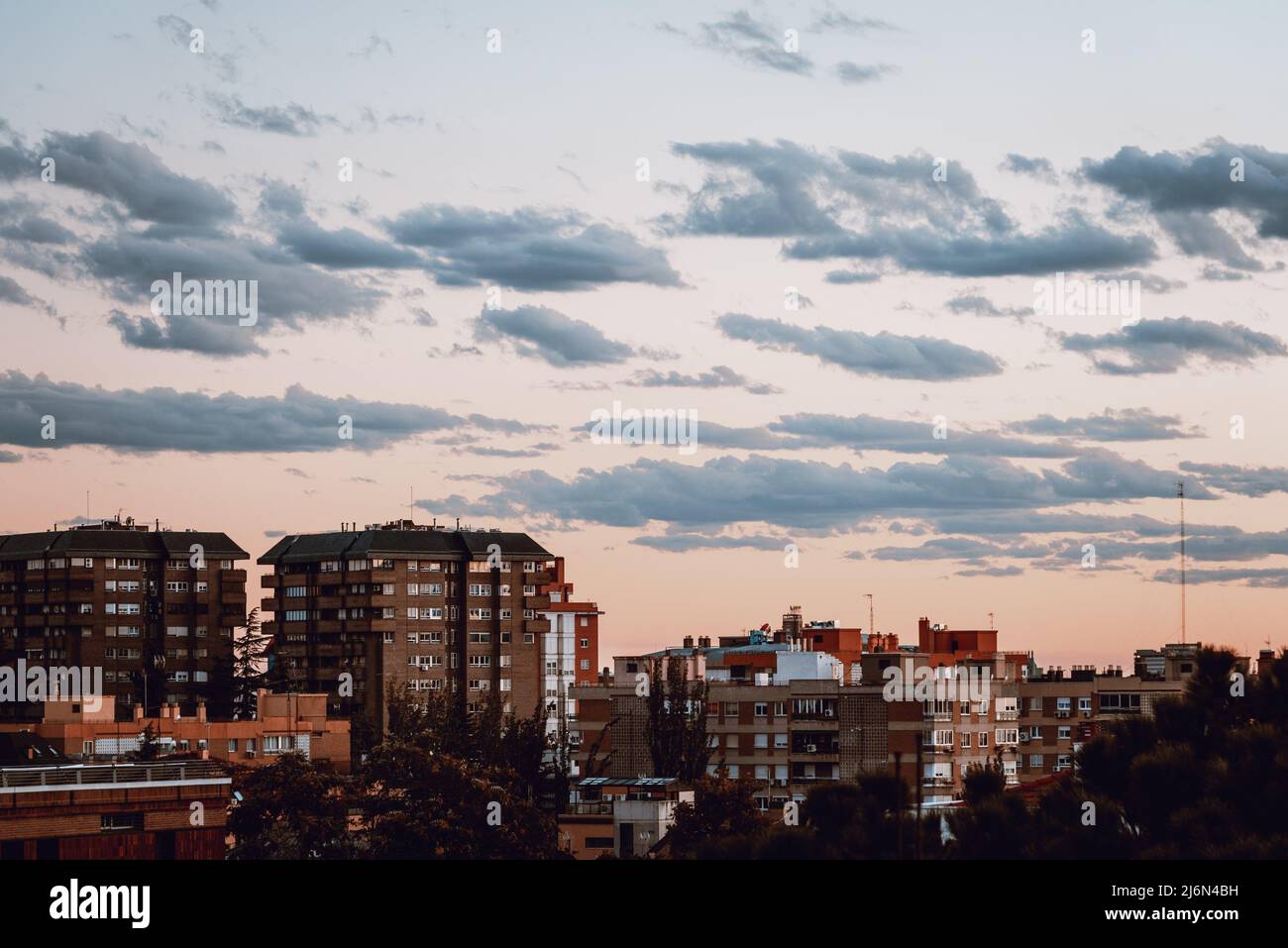 Cityscape of upscale luxury neighborhood in Madrid. Arturo Soria area. View at sunset. Real estate and residential market concept. Stock Photo