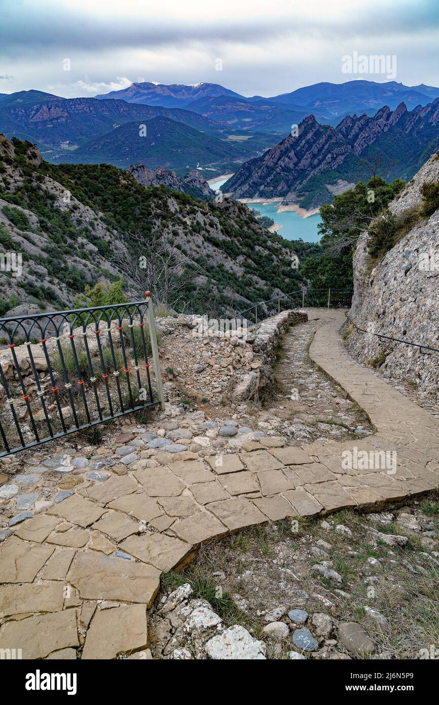 Stair way up to the Sanctuary of Lord in Sant Llorenç de Morunys, Lleida, with a reservoir in the background. Stock Photo