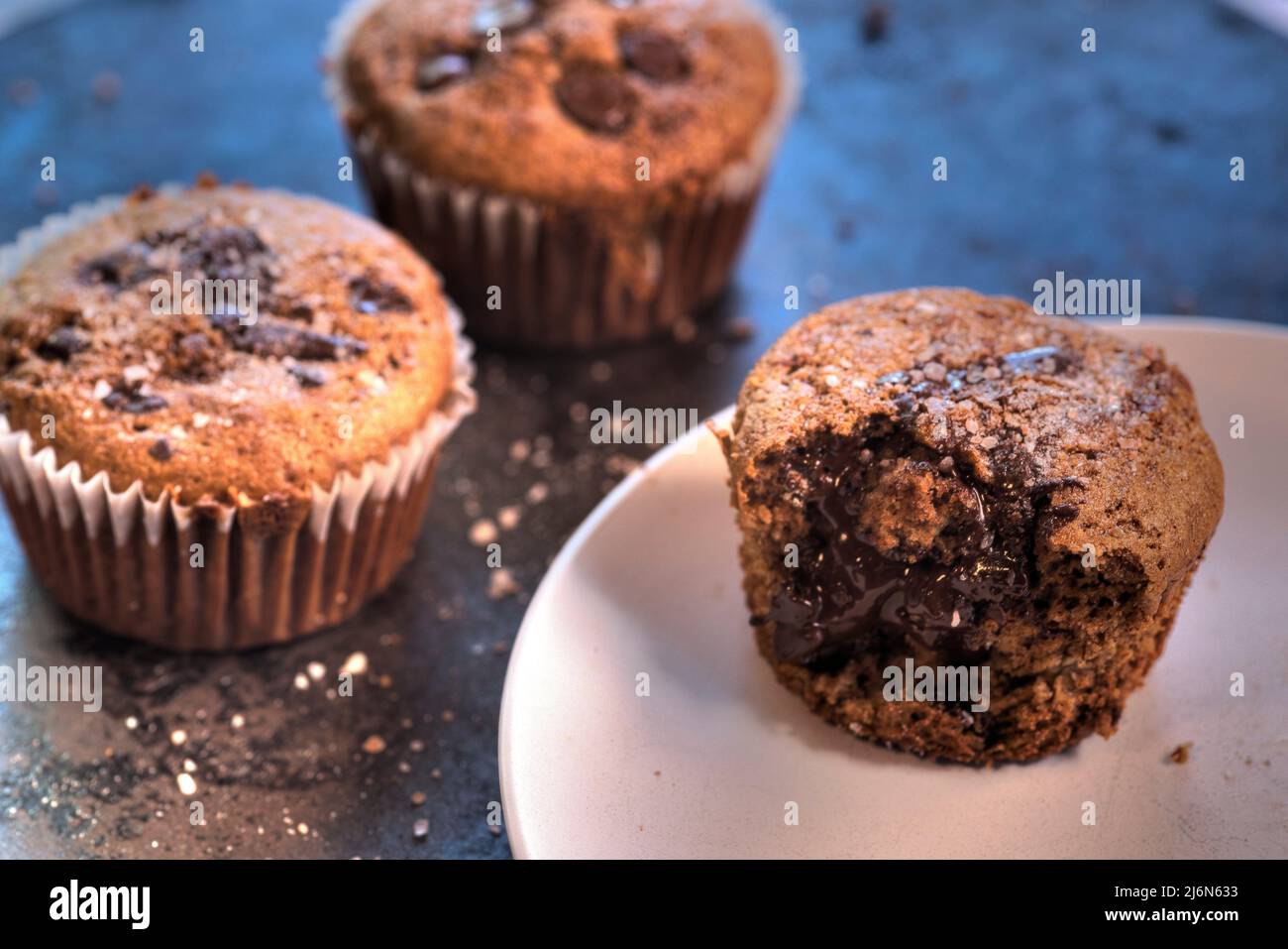 Side view of banana chocolate oat muffin. Stock Photo