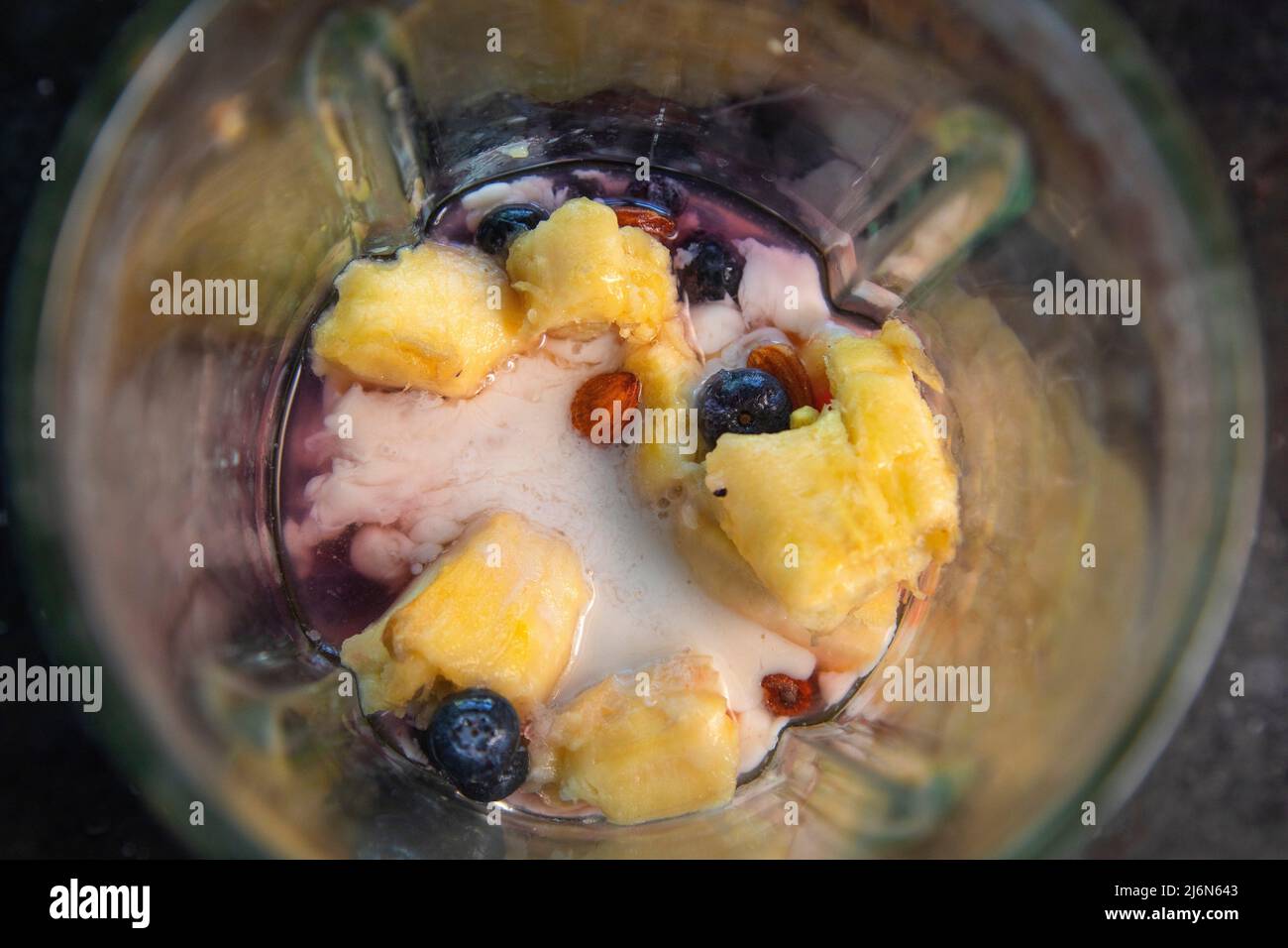 Top view of fruit smoothie in blender. Stock Photo