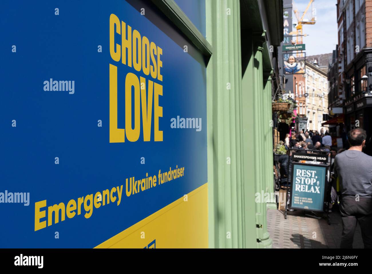 Choose love, emergency Ukraine fundraiser sign in an empty shop space on 11th April 2022 in London, United Kingdom. Stock Photo