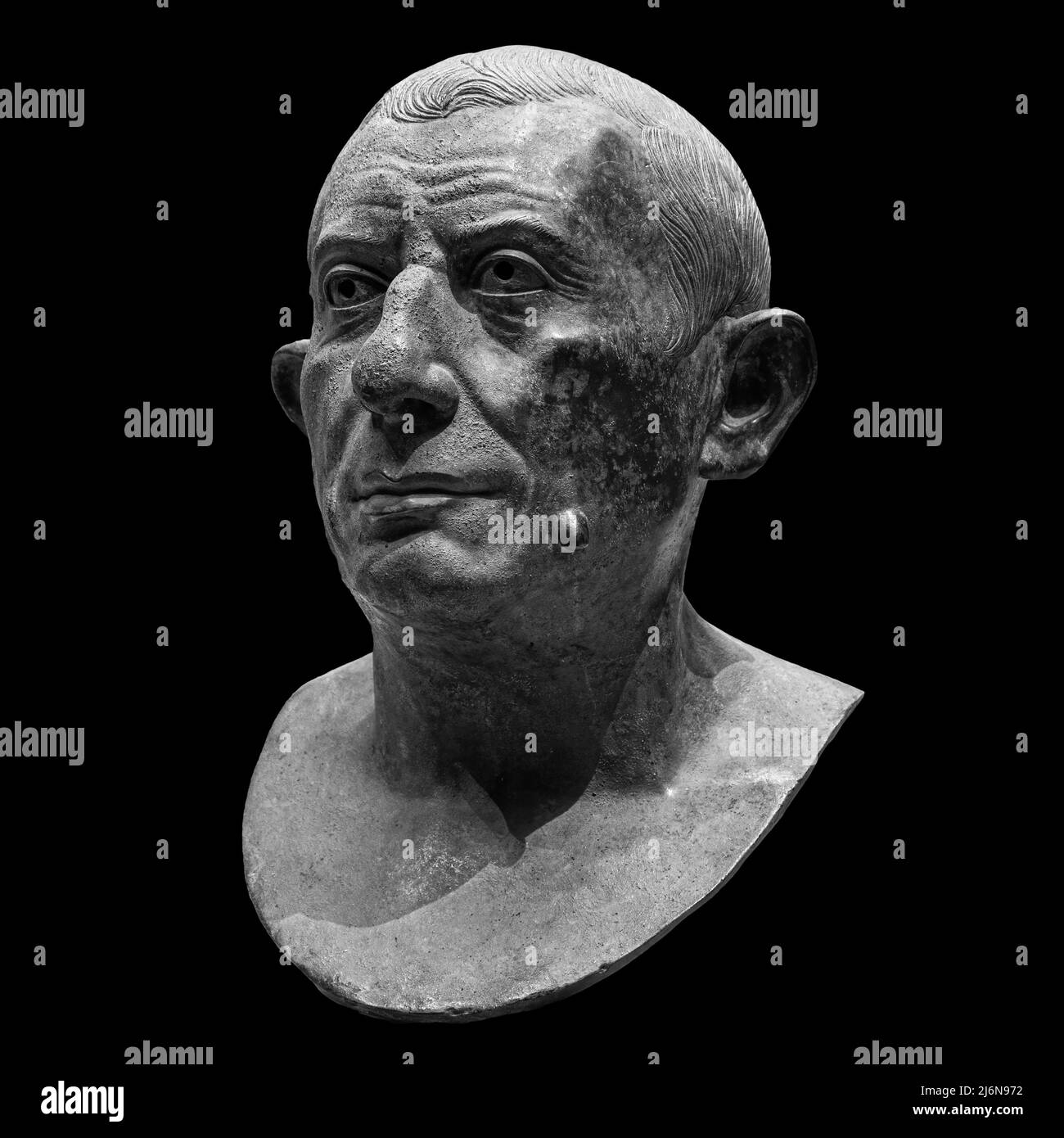 Copy of ancient statue Lucius Caecilius Iucundus. Head and shoulders detail of the ancient man sculpture. Antique face statue isolated on black Stock Photo