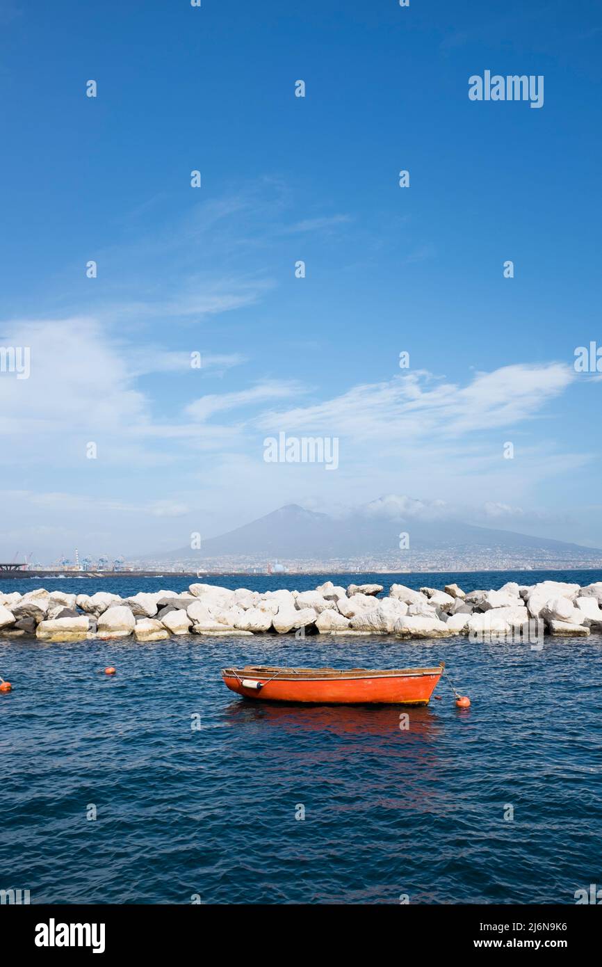 Fishing Boats in the Bay of Naples looking towards from Lungomare di Napoli Mount Vesuvius Naples Italy Stock Photo