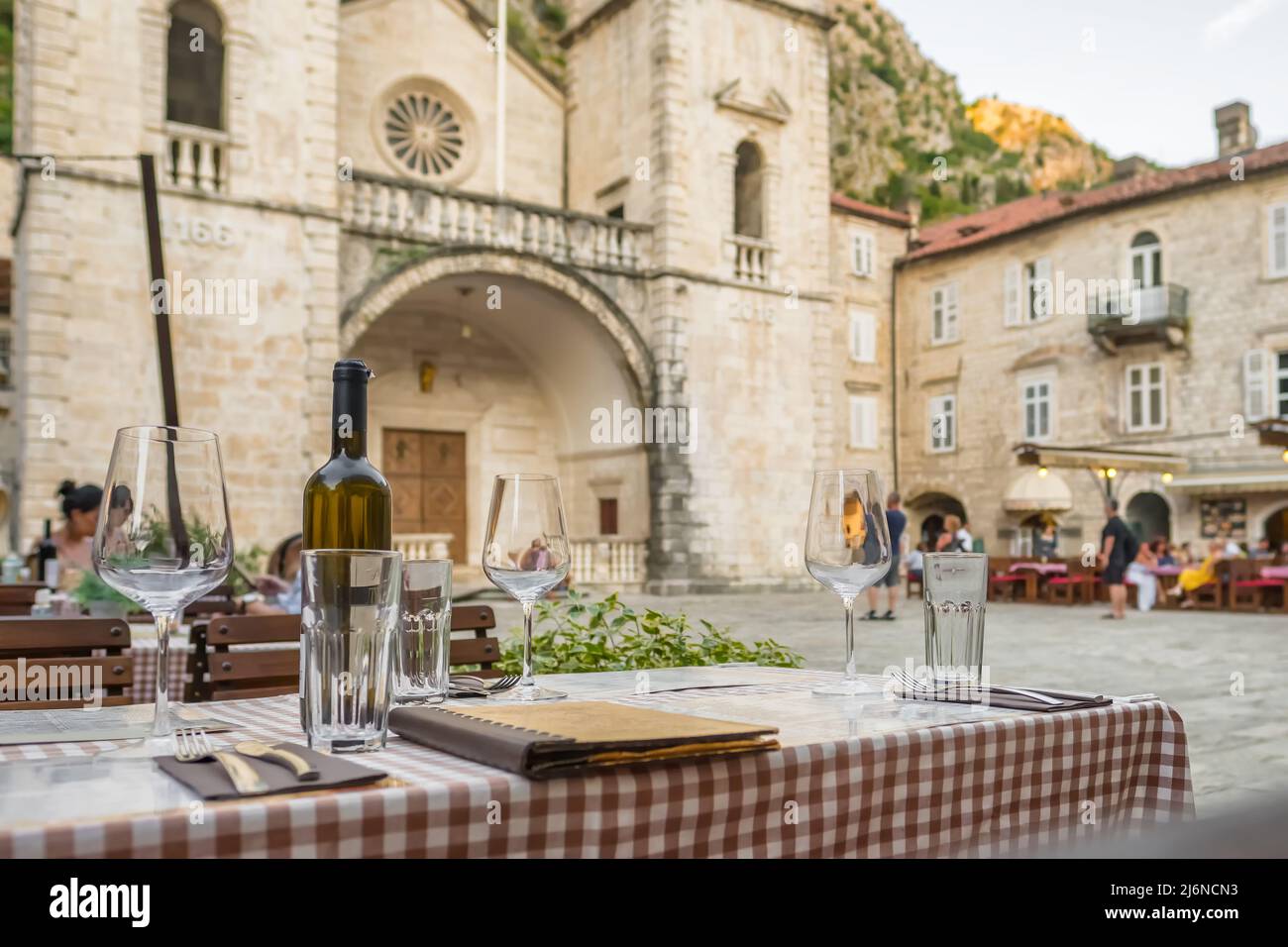 Outdoor street cafe in Kotor old town square in Montenegro Stock Photo