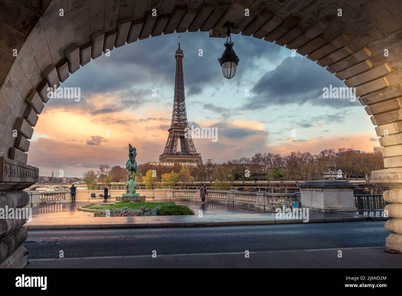 Paris, France - November 19, 2020: Eiffel tower seen from arch of Bir Hakeim bridge in Paris Stock Photo