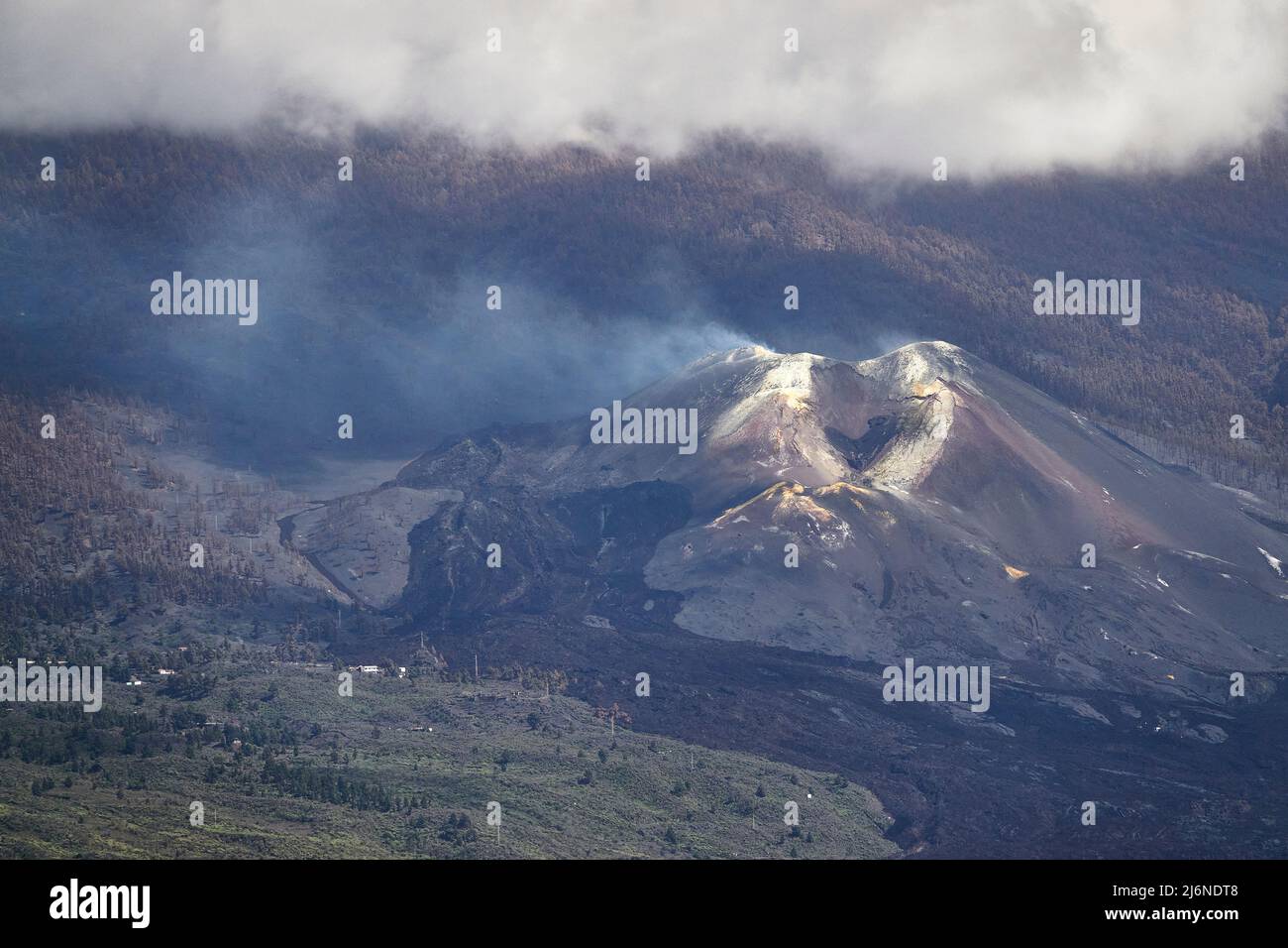 Sunbeam Illuminates Smoking Nameless Volcanic Crater. Sulfur Deposits And Black Magma Flows. El Paso La Palma Canary Islands Spain Stock Photo