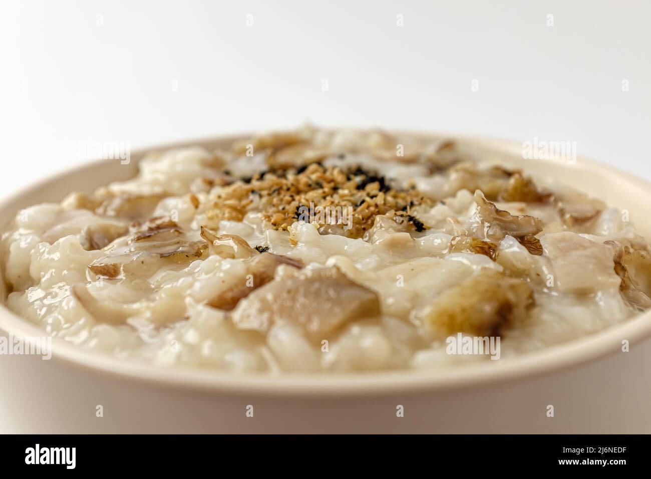 food with abalone. porridge made by boiling rice. dishes with seafood Stock Photo