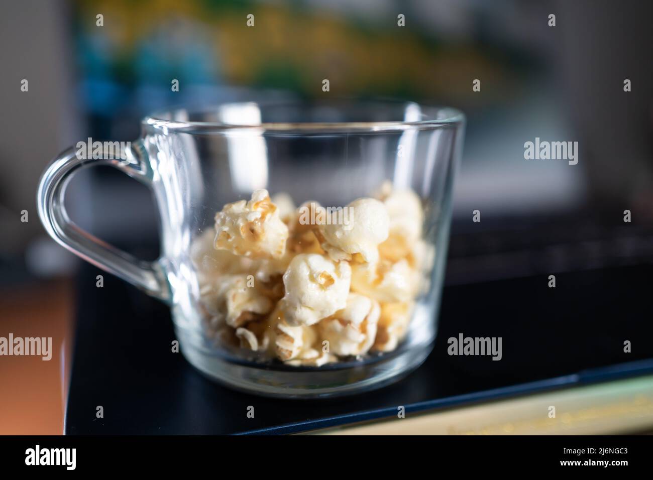 Caramel popcorn in glass mug Stock Photo