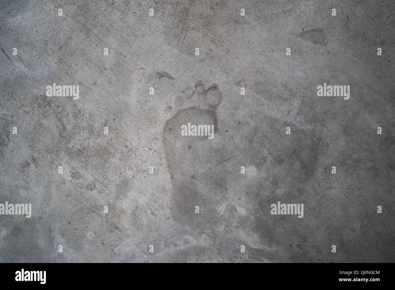 Concrete texture with left human footprint Stock Photo