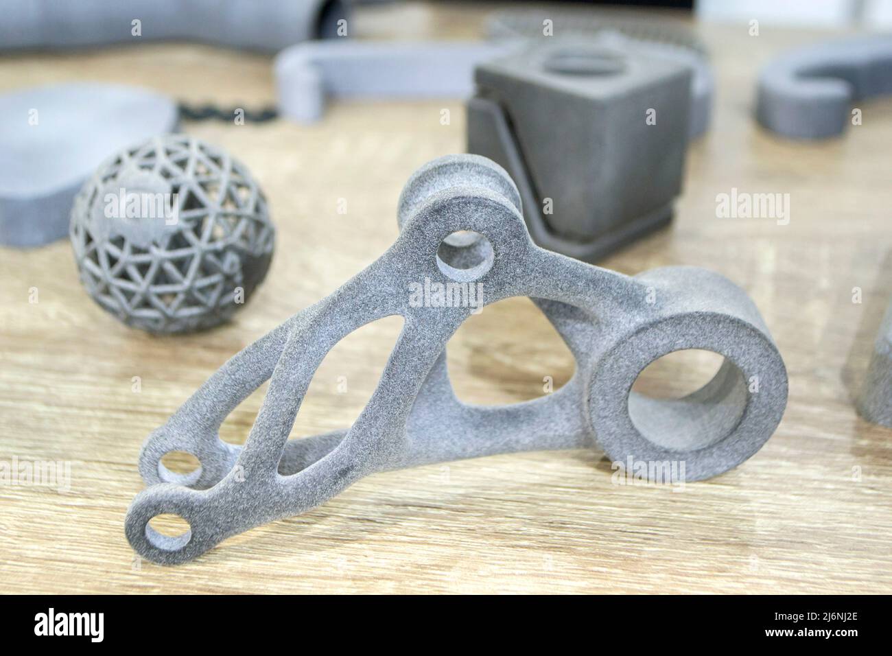 Many different models printed on 3D printer. Gray objects printed on 3D printer Stock Photo