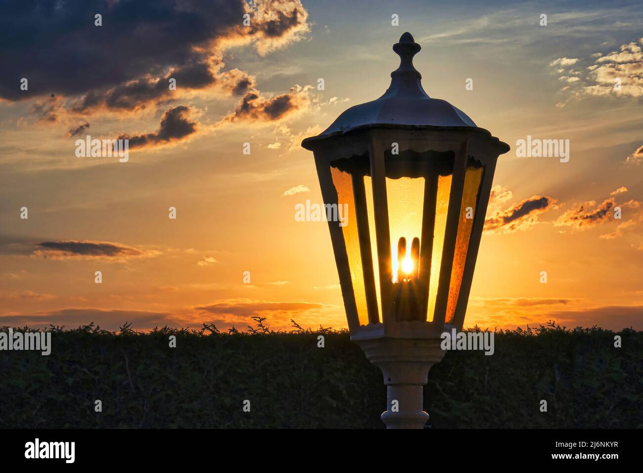 The sun shines behind the cloud hi-res stock photography and images - Alamy