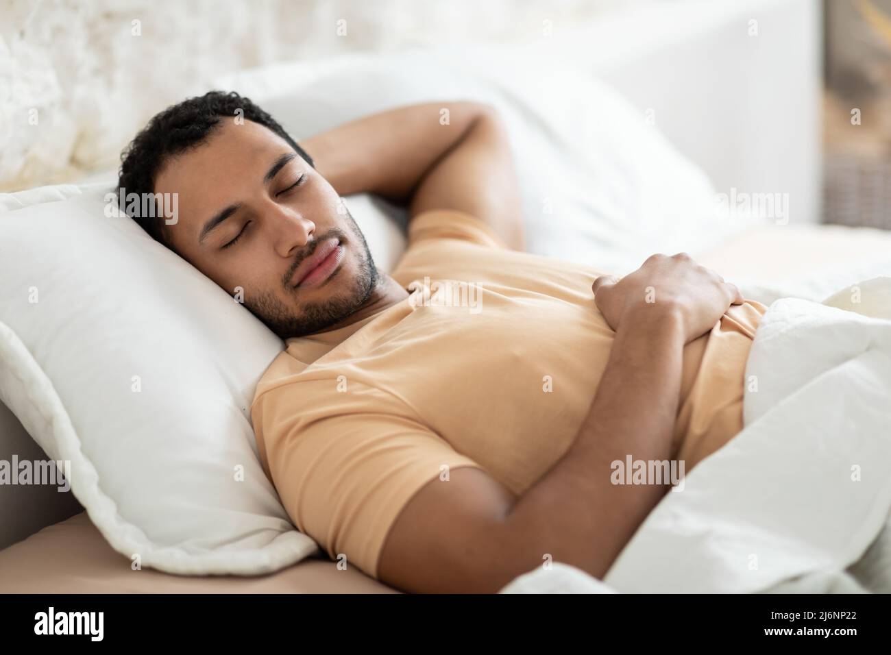 Middle Eastern Man Sleeping Lying On Pillow In Bed Indoor Stock Photo