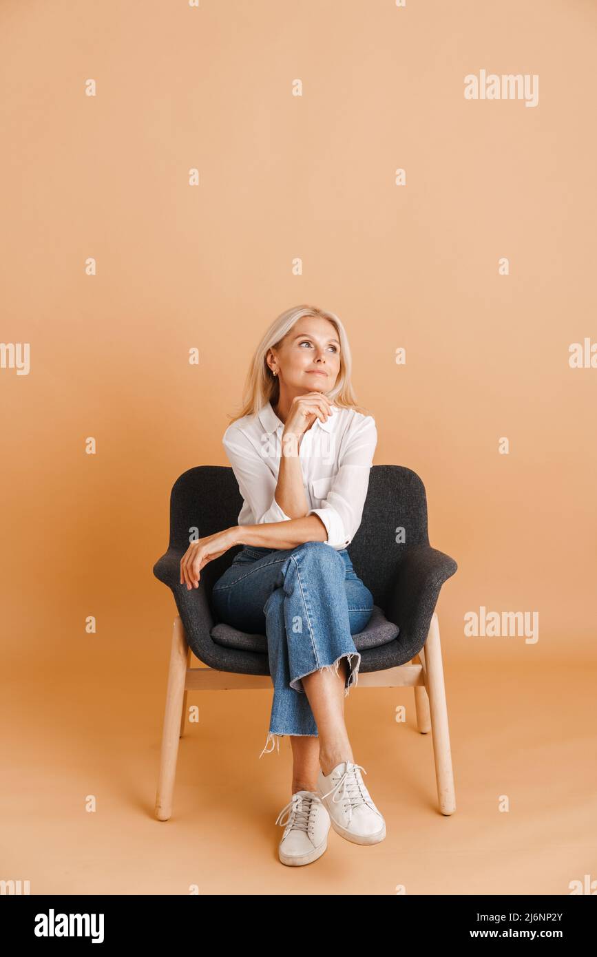 Blonde woman in pose chair hi-res stock photography and images - Alamy