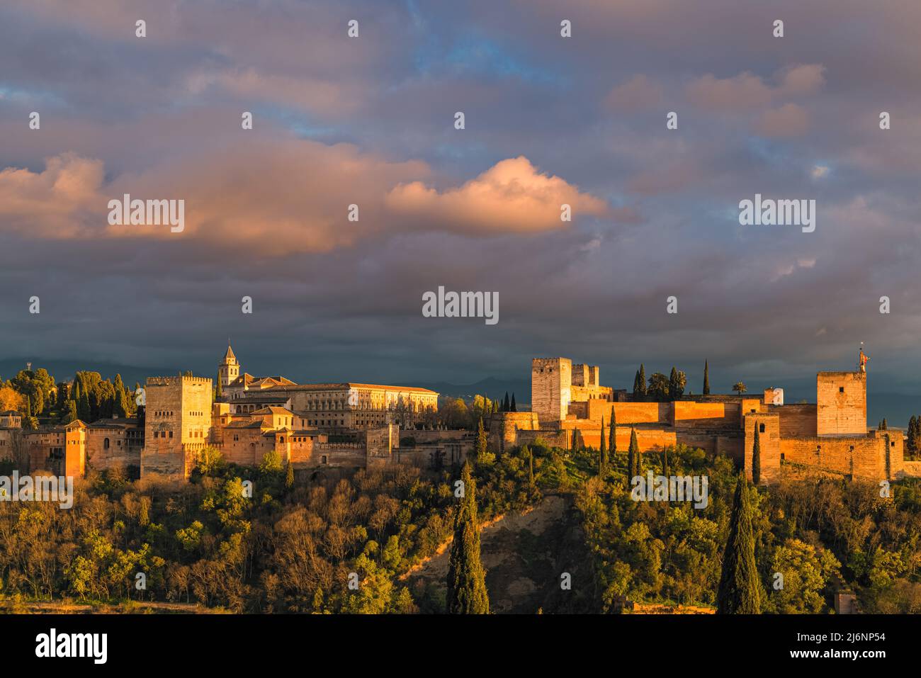 The Alhambra is a palace and fortress complex located in Granada, Andalusia, Spain. It is one of the most famous monuments of Islamic architecture and Stock Photo