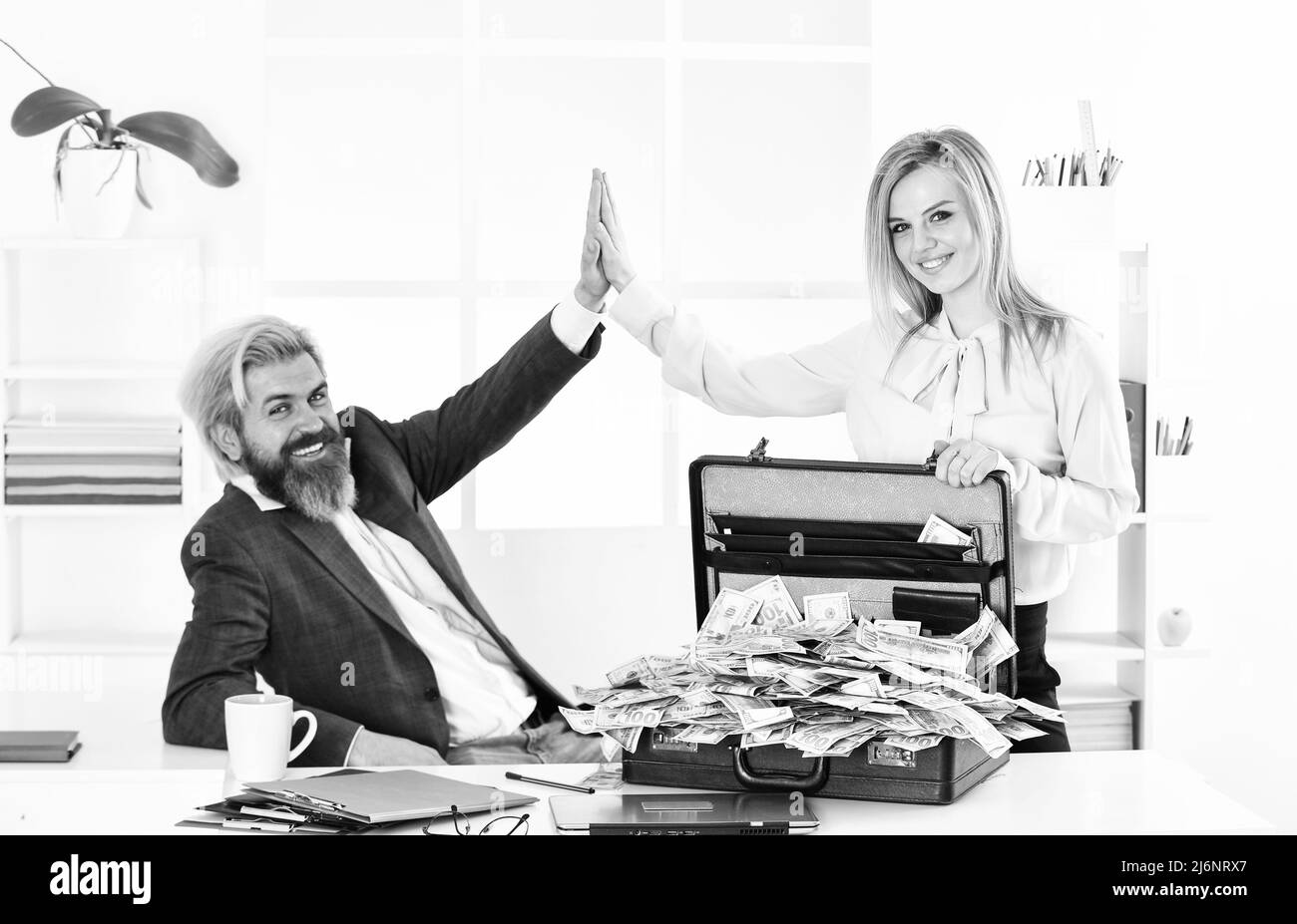 Financial success. Tax service. Financial expert. Taxation. Illegal profit. Man with briefcase full of cash. Financial achievement. Money laundering Stock Photo