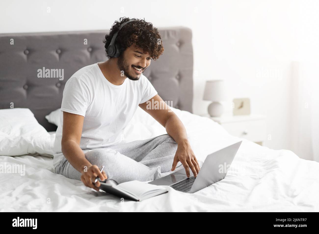 Young indian man student attending webinar from home, e-education Stock Photo