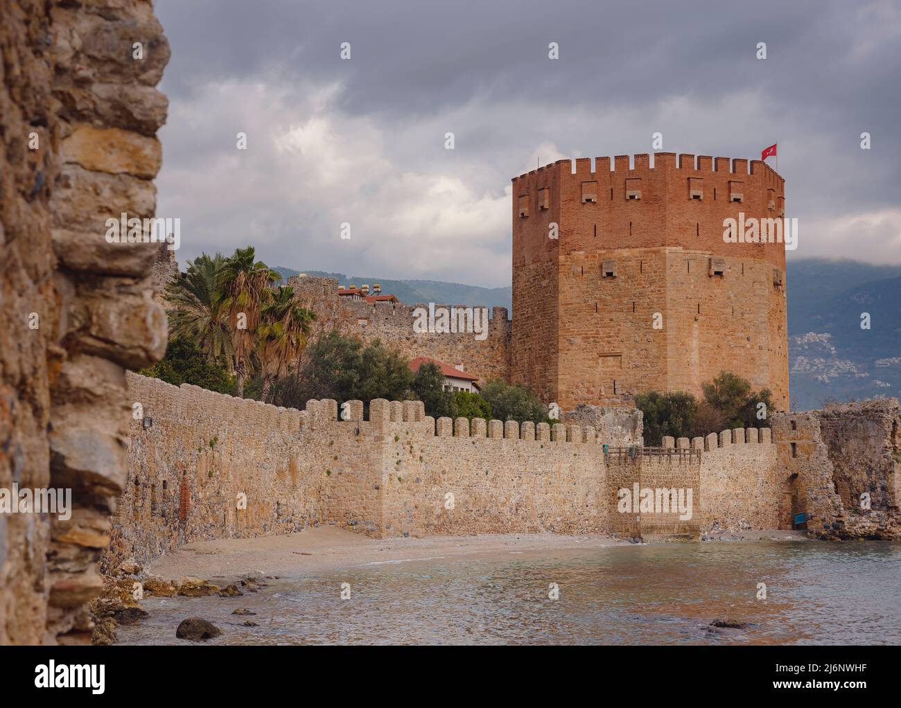 Alanya, turkey, winter walk by mediterranean sea. Kizil Kule tower on