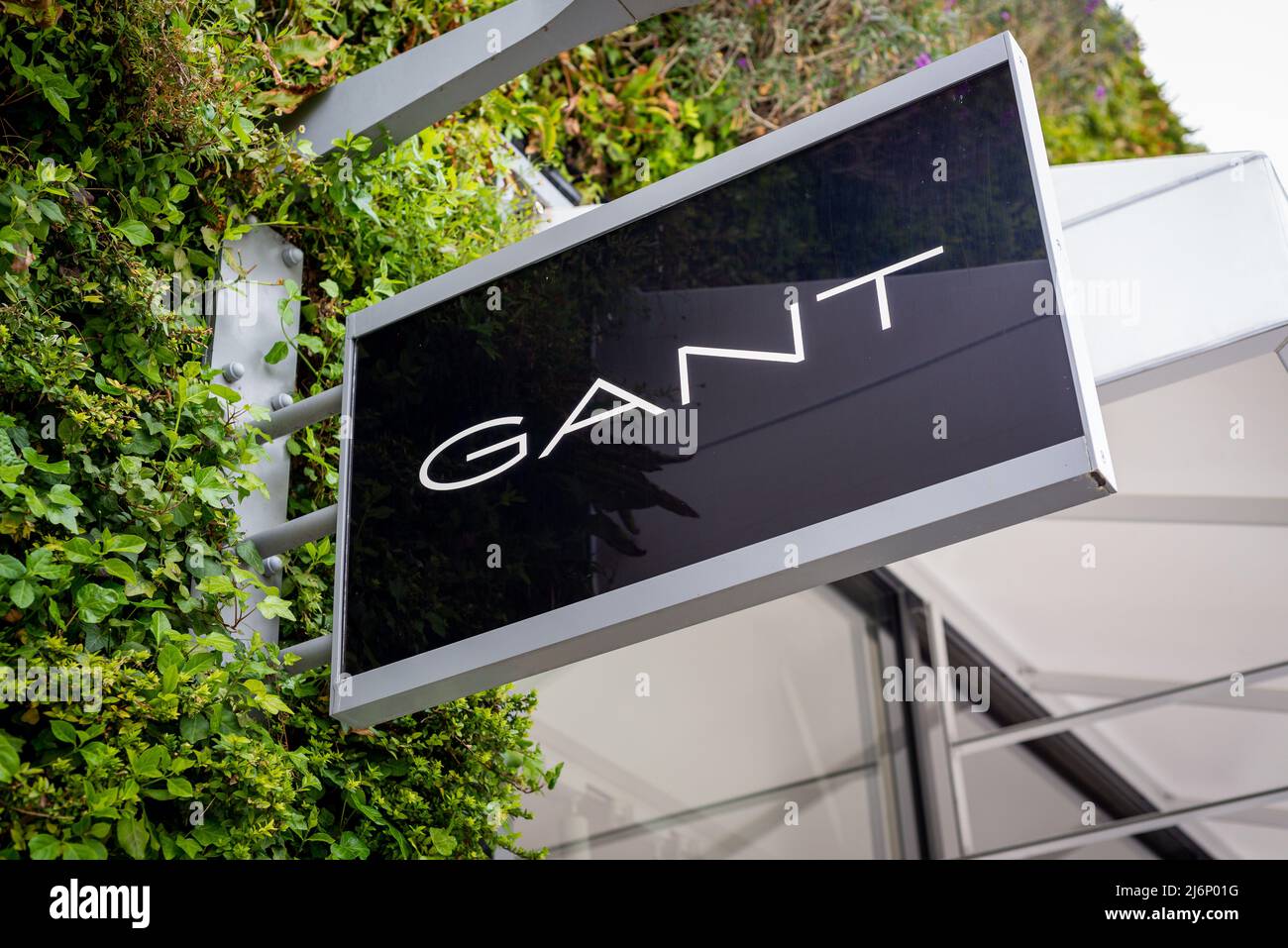 Close up of Gant retail clothes shop sign at Ashford Outlet Center, Kent, England, UK. Stock Photo