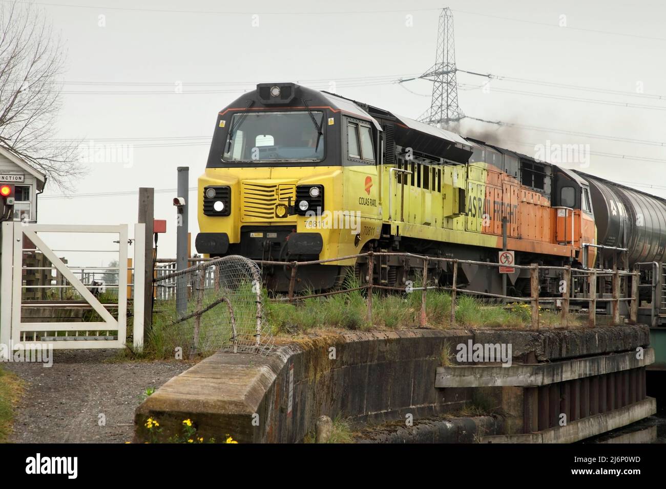 Colas Rail Freight Class 70 loco 70811 hauls the 1005 Colas Ribble Rail to Lindsey Oil Refinery service over the Stainforth & Keadby canal: 3/5/22. Stock Photo