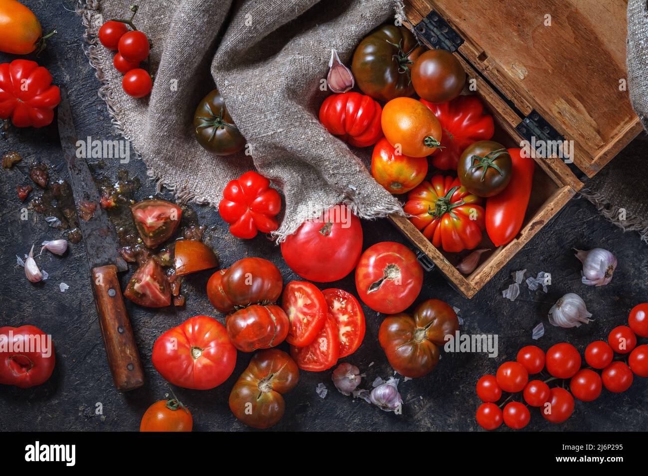 Fresh colorful ripe tomatoes of various heirlooms varieties, sliced ...