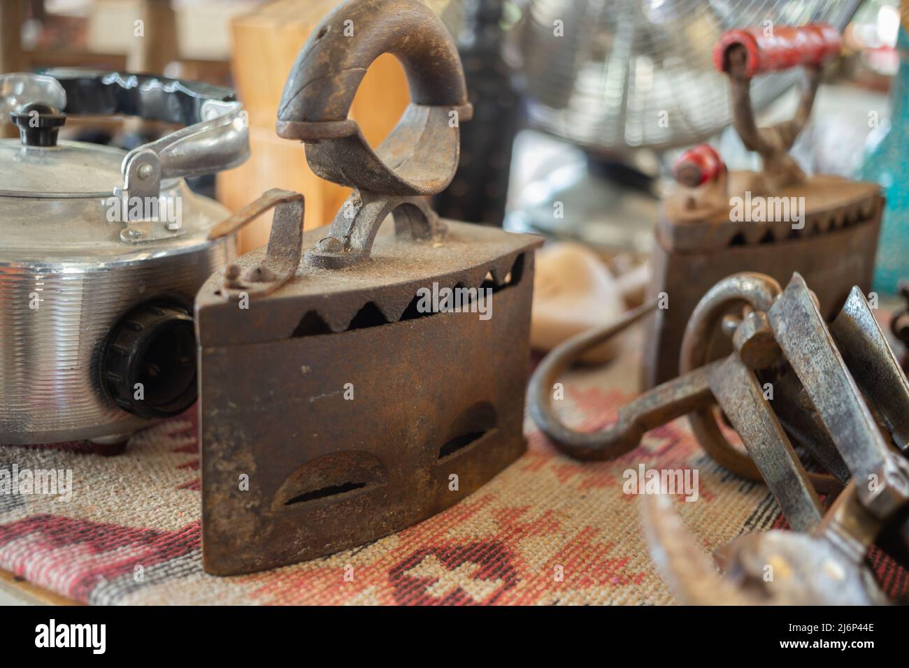 Old smoothing iron in flea market in Bodrum, Turkey. Old style, antiquities. Stock Photo
