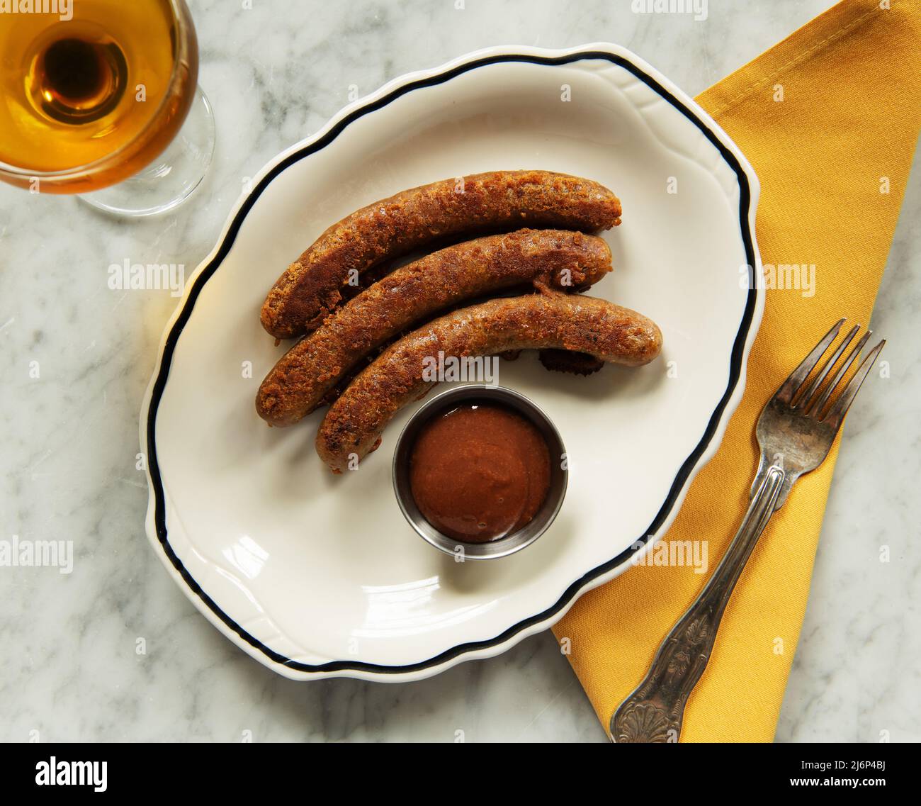 Fried sausages with ketchup and a cocktail Stock Photo