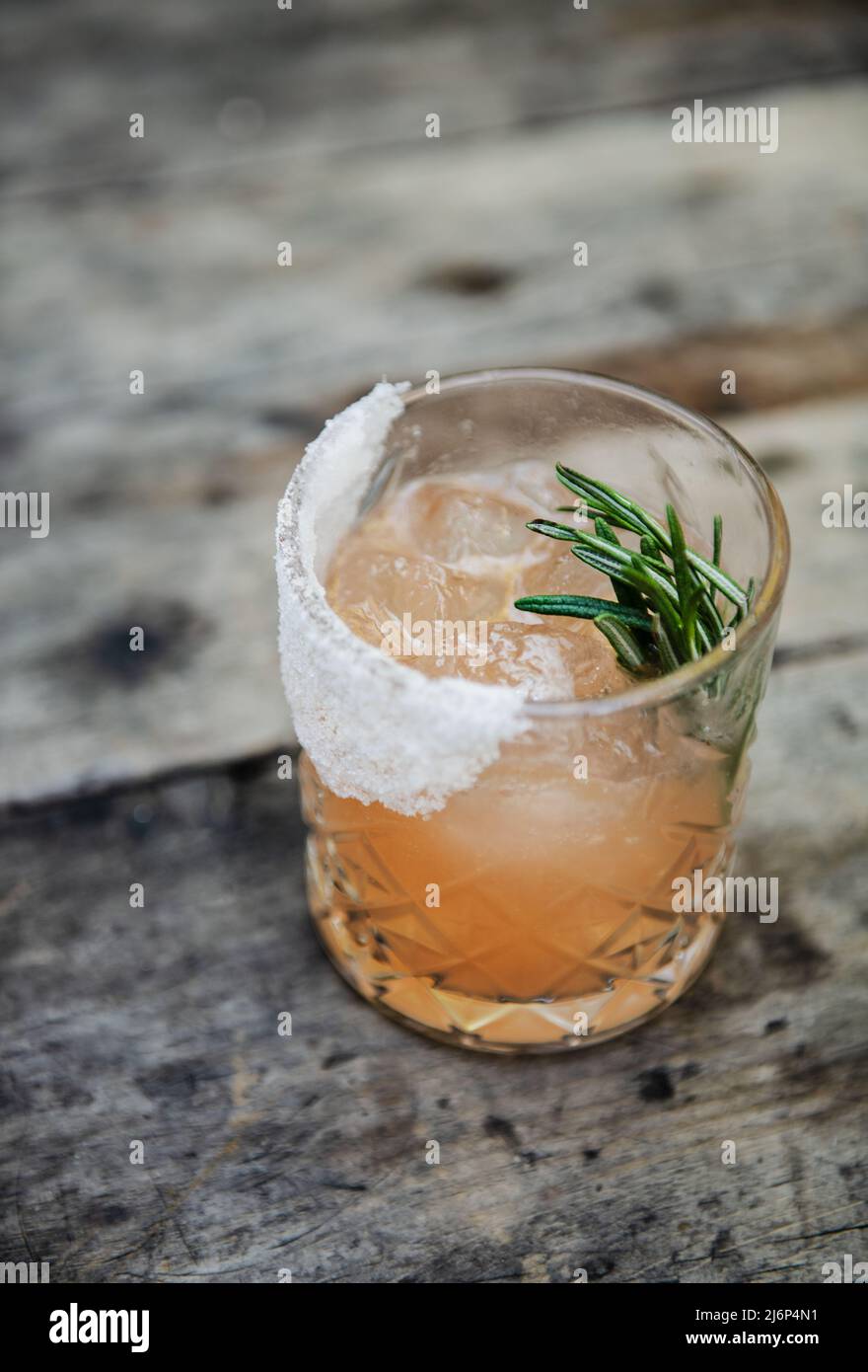 Grapefruit Rosemary cocktail with a sugar rim Stock Photo