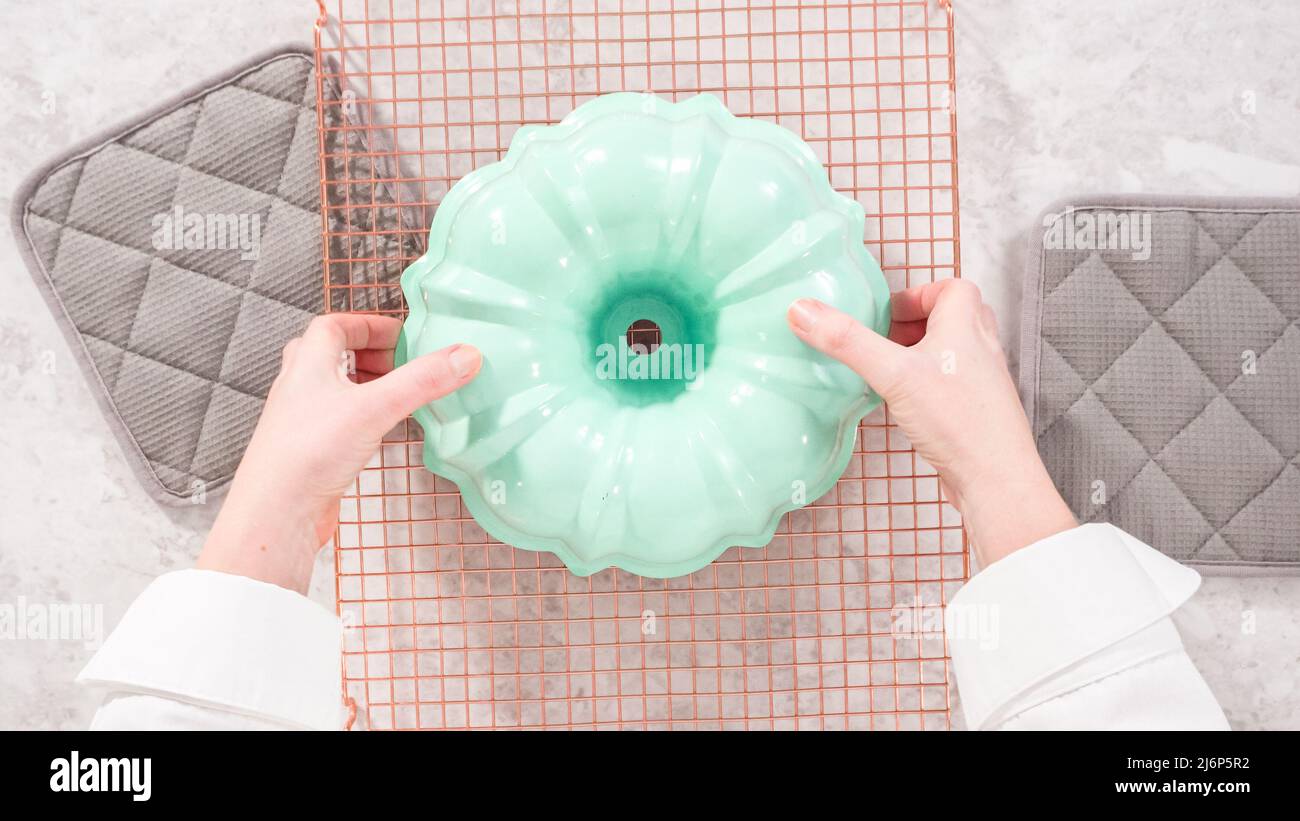Flat lay. Step by step. Removing freshly baked funfettti bundt cake