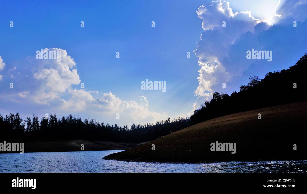 Beautiful view of Pykara Lake, Ooty, Tamilnadu. Awesome scenery of landscapes of sky,water and green bushes visible from boat ride. Best honeymoon des Stock Photo