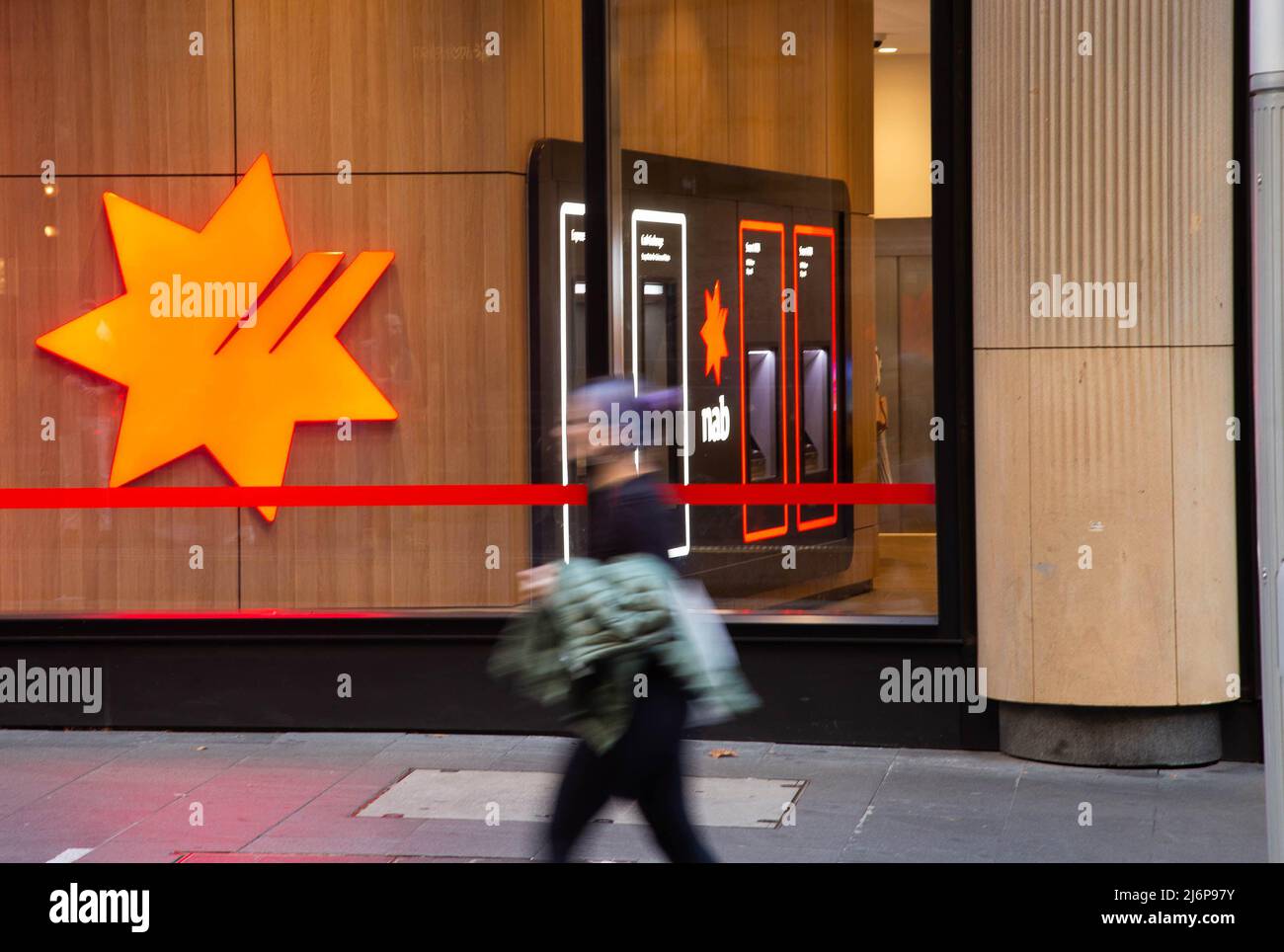 (220503) -- SYDNEY, May 3, 2022 (Xinhua) -- A pedestrian walks past a bank in Sydney, Australia, on May 3, 2022. After dropping interest rates down to historic low levels during the pandemic, the Reserve Bank of Australia (RBA) has lifted interest rates by 0.25 to 0.35 percent, the first rise since 2010, in an effort to calm growing inflation. (Photo by Hu Jingchen/Xinhua) Stock Photo