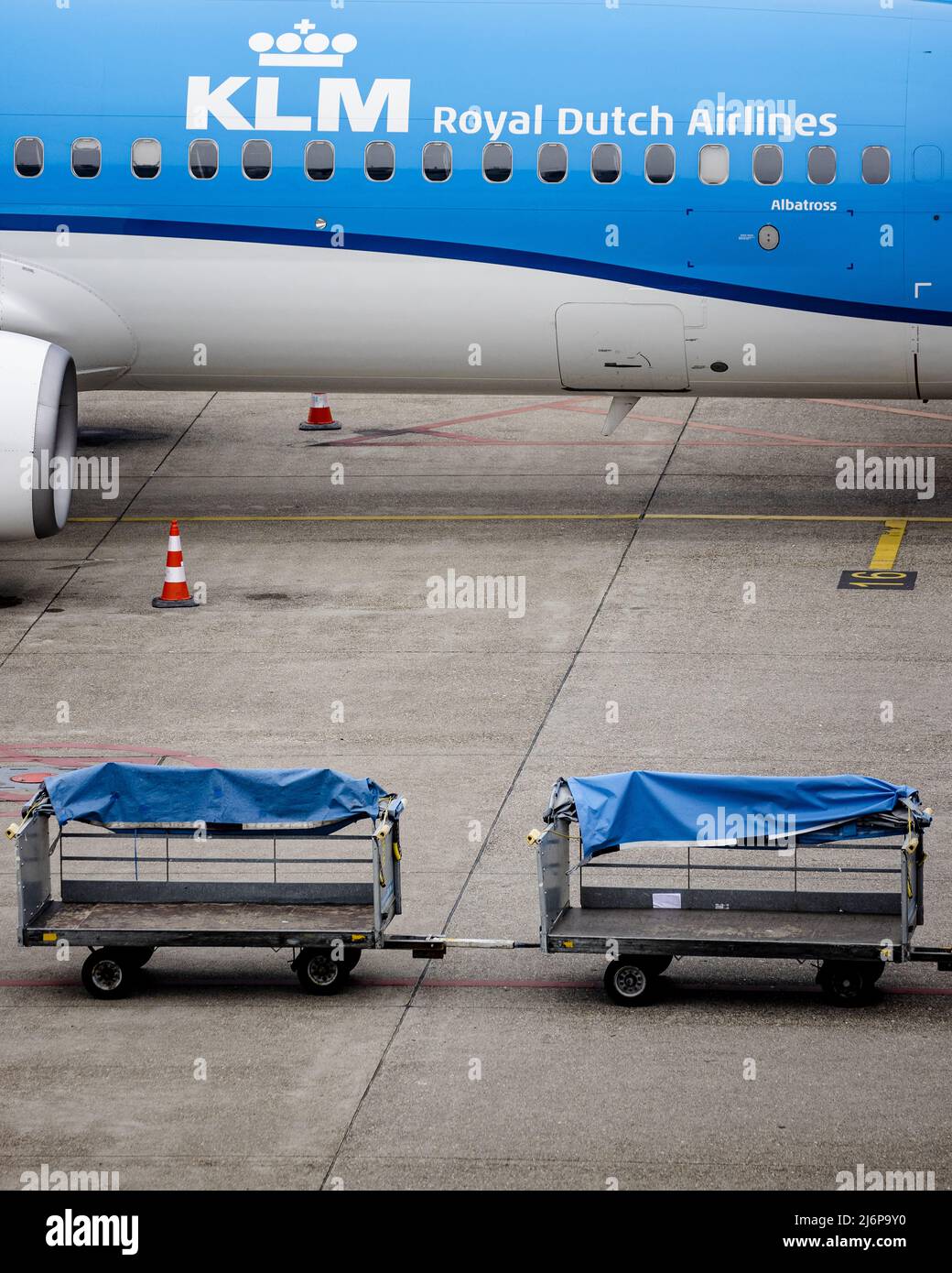 2022-05-03 10:36:25 SCHIPHOL - Empty KLM baggage carts at Schiphol Airport. Due to the large crowds, Schiphol asked airlines to reduce the number of travelers for last weekend. It will also remain busy in the coming days of the May holiday. ANP SEM VAN DER WAL netherlands out - belgium out Stock Photo