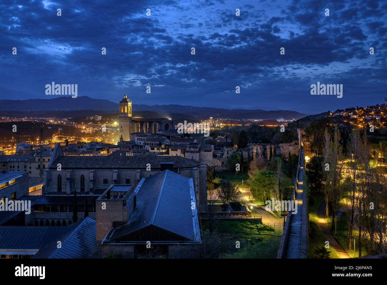 The city of Girona seen from the Sant Domènec tower in the wall of Girona, at twilight and night (Girona, Catalonia, Spain) ESP: Ciudad de Gerona Stock Photo