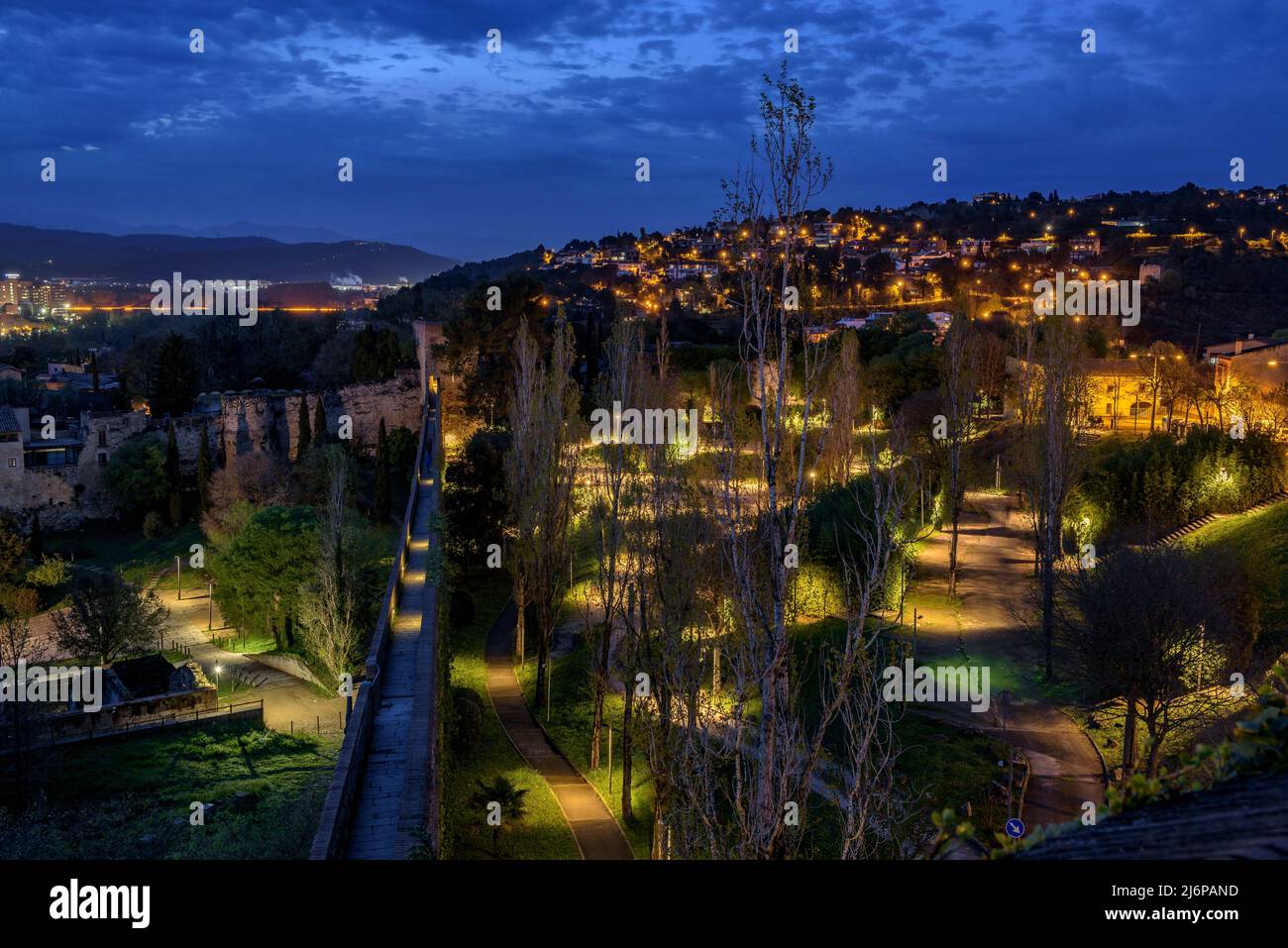 The city of Girona seen from the Sant Domènec tower in the wall of Girona, at twilight and night (Girona, Catalonia, Spain) ESP: Ciudad de Gerona Stock Photo