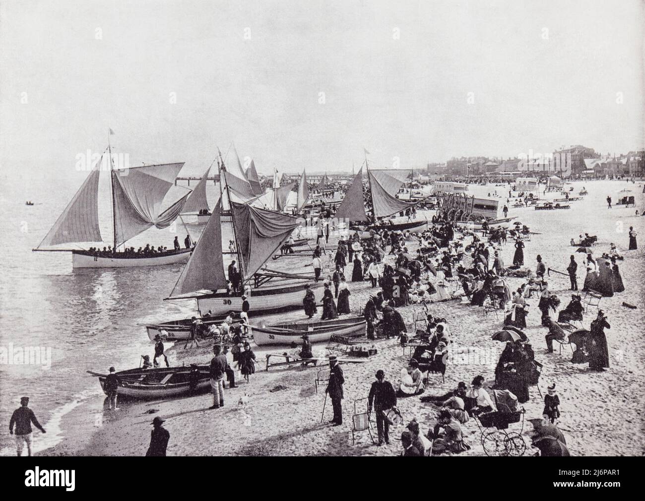 Great Yarmouth, Norfolk, England.  A typical scene on the beach in the 19th century.  From Around The Coast,  An Album of Pictures from Photographs of the Chief Seaside Places of Interest in Great Britain and Ireland published London, 1895, by George Newnes Limited. Stock Photo