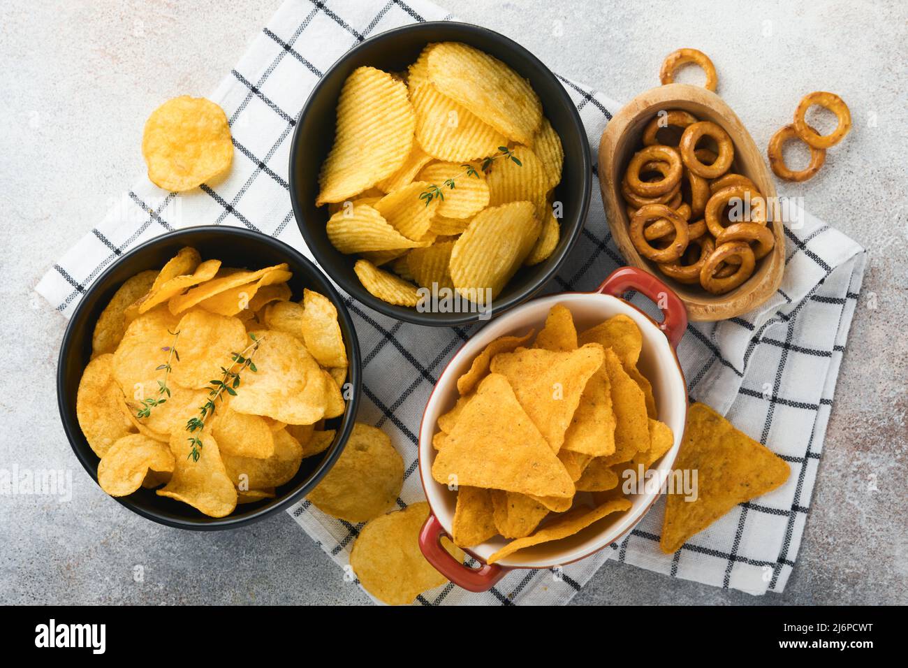 Snacks. Unhealthy food. All classic potato snacks with peanuts, popcorn