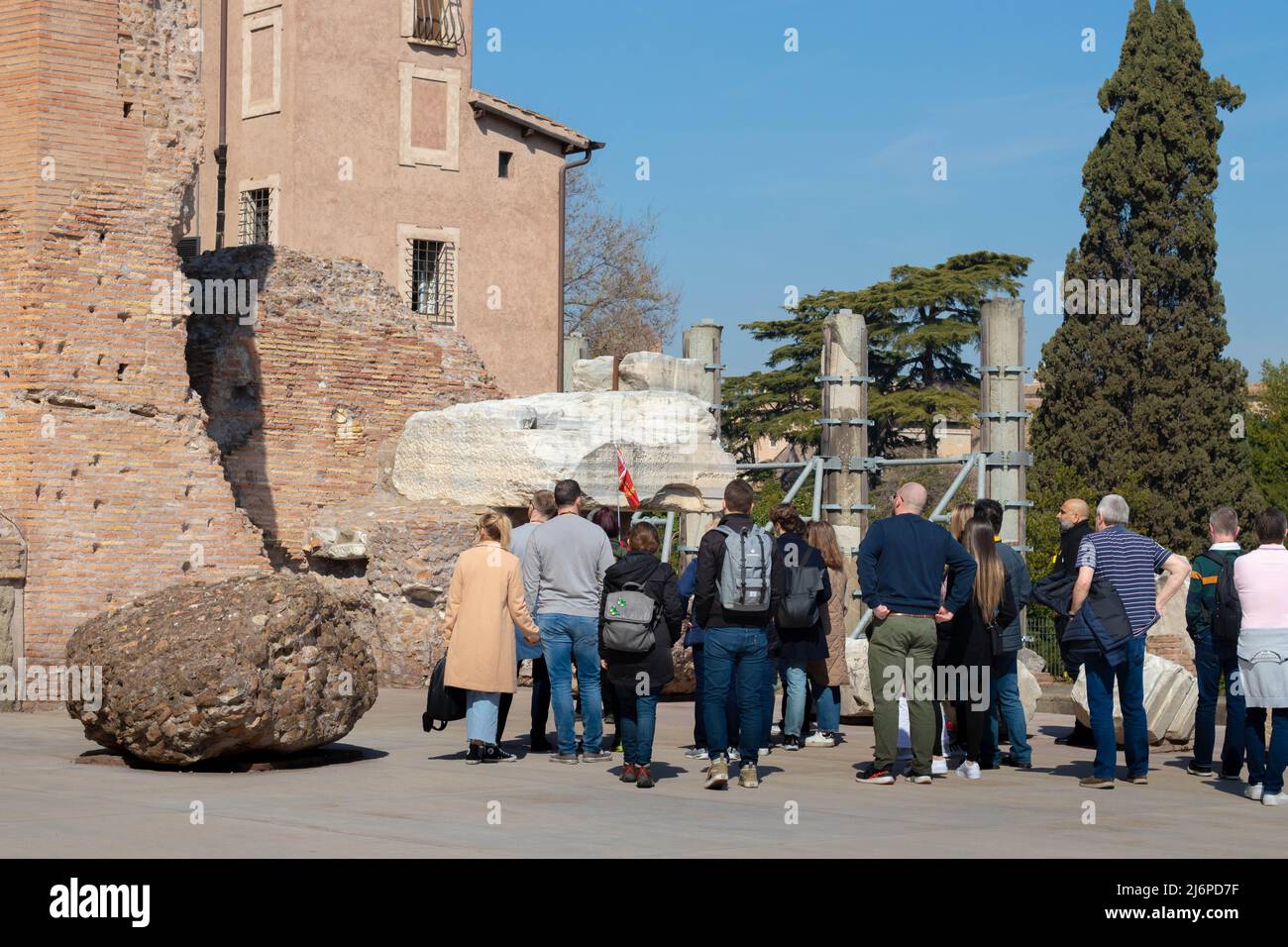 Rome, Italy - March 17th, 2022. Large group of tourists with a tourist guide explaining history on the Palatine Hill in Rome, Italy Stock Photo