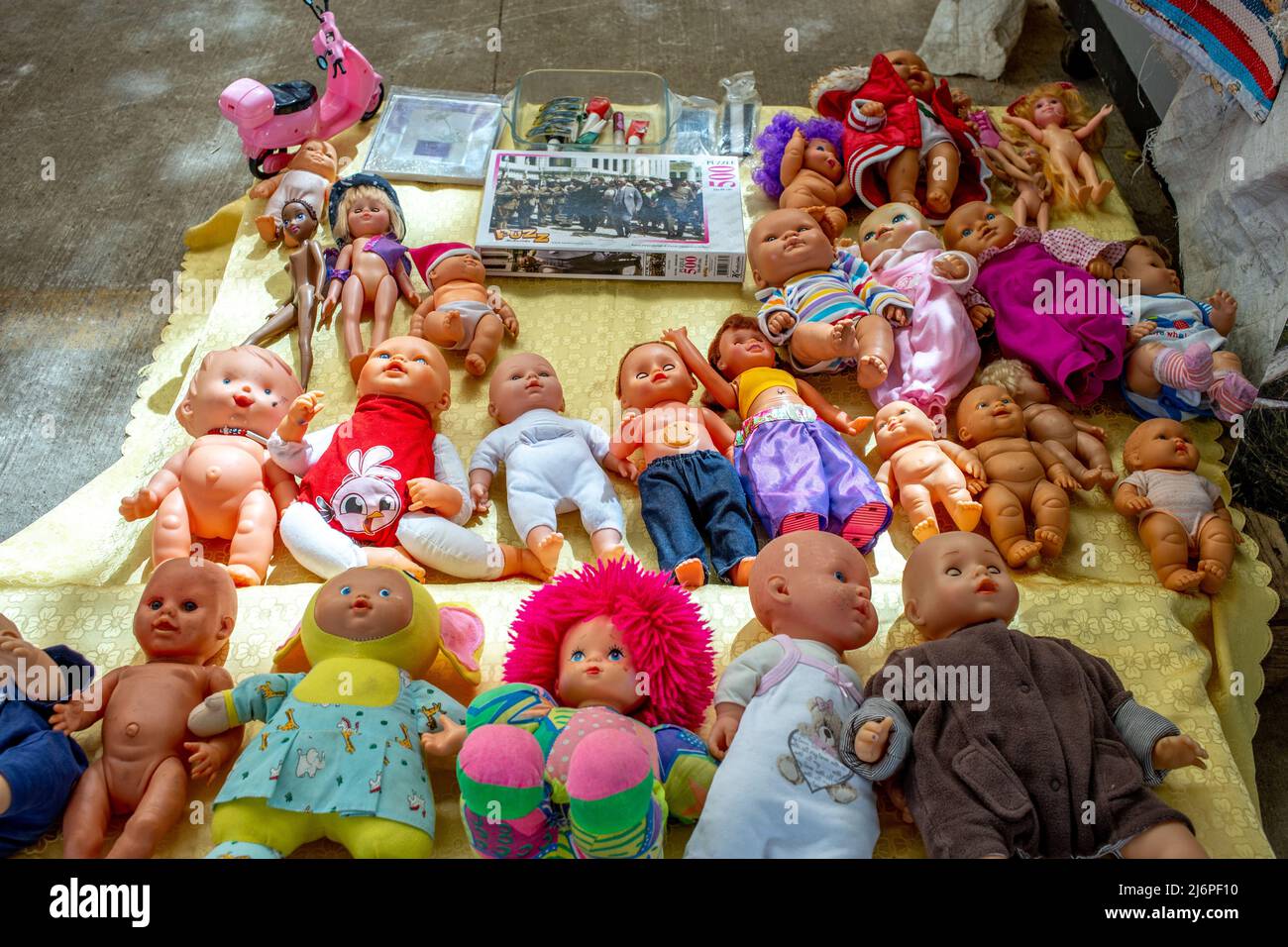 Set of many old different dolls in flea market in Bodrum, Turkey. Stock Photo