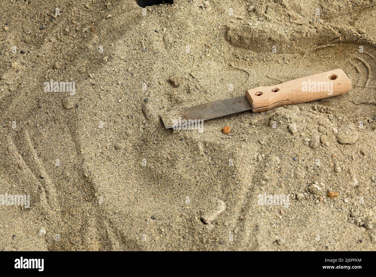 Skeleton and archaeological tools in the sand.Digging for fossils. Stock Photo