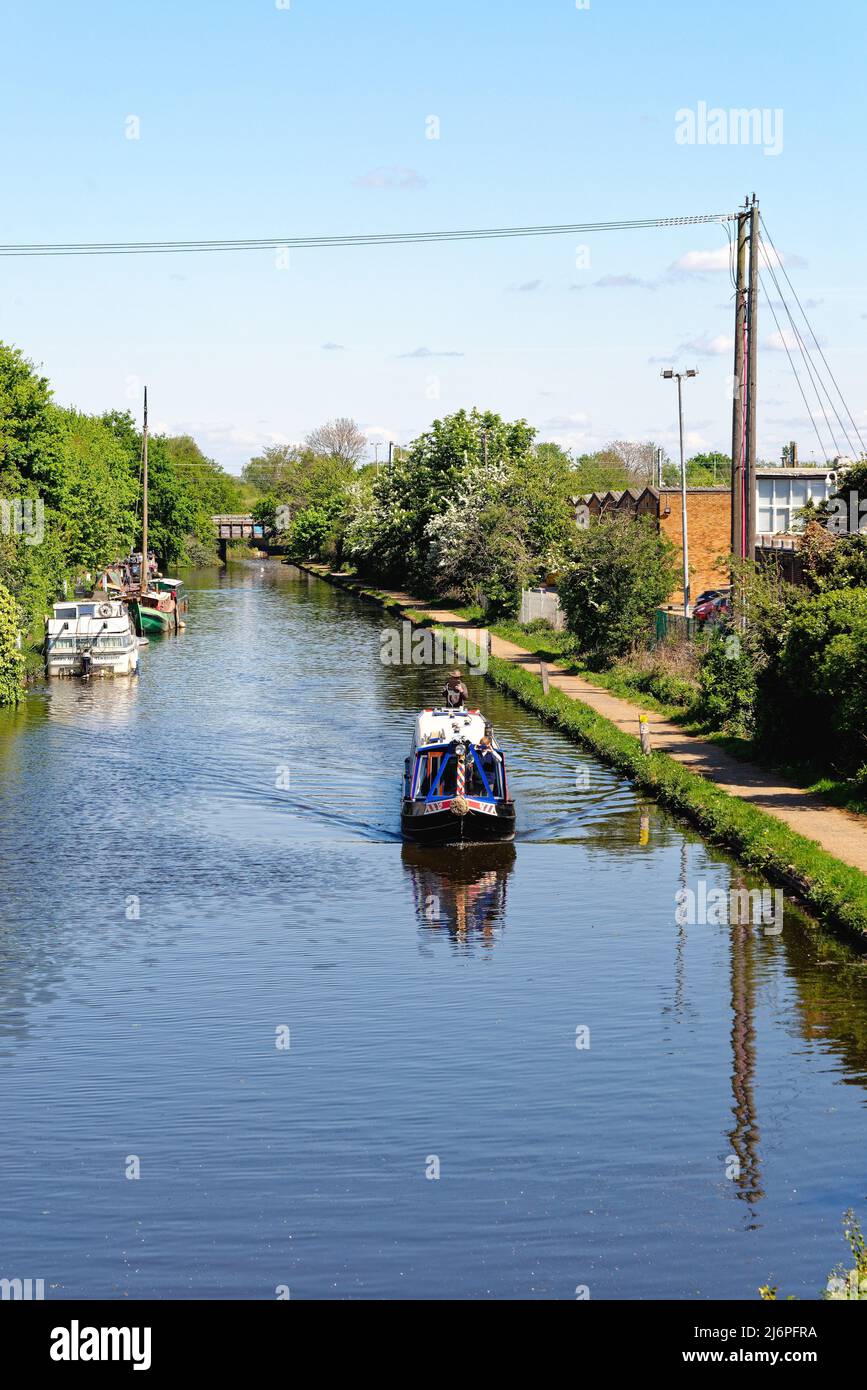 A narrow boat cruising on the Paddington branch of the Grand Union