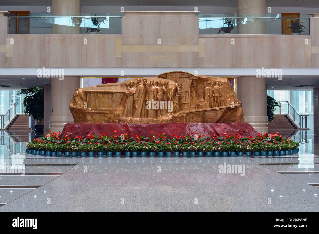 Beautiful Red Boat statue inside the local Government building in Jiaxing, China. Monument to the famous historical boat in the city. Stock Photo