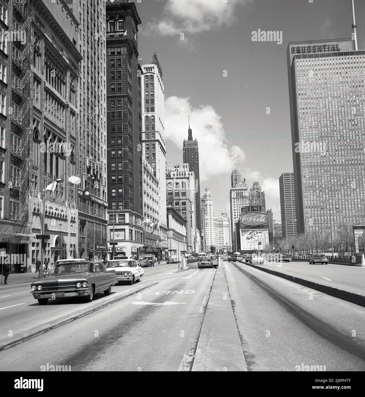 1950s, historical picture by J Allan Cash of N. Michigan Ave, Chicago, USA, showing the Maremont Bldg, Prudential Building and American automobiles of the era. The mid American headquarters of the US Insurance company Prudential was a 41-story building completed in 1955, and significant as the first skyscraper built in Chicago since the 1930s Great Depression and the Second World War. On the far right, the entrance to the underground parking at Grant Park. Opened in 1954, the Grant Park (North) Garage, was a giant municipal parking space with three levels and 1,850 spaces. Stock Photo
