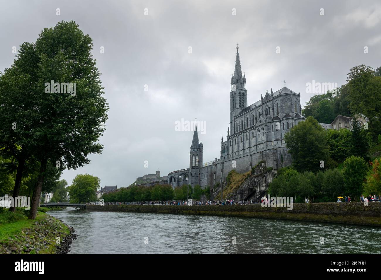 Rainy day at the sanctuary of Our Lady of Lourdes, France Stock Photo ...