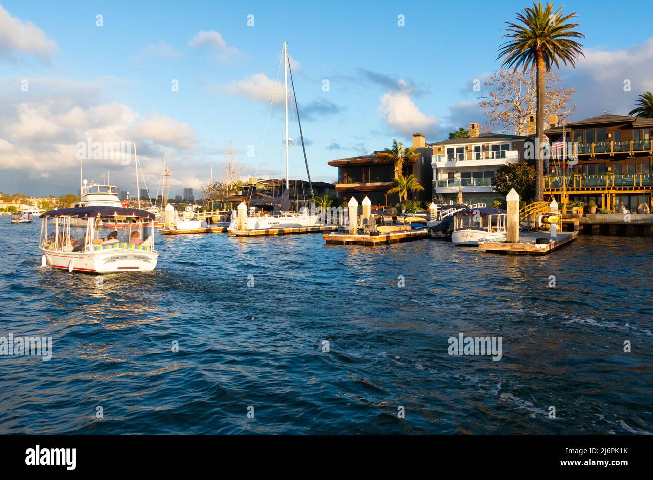 Early evening Harbor cruise in a Duffy electric boat Newport beach