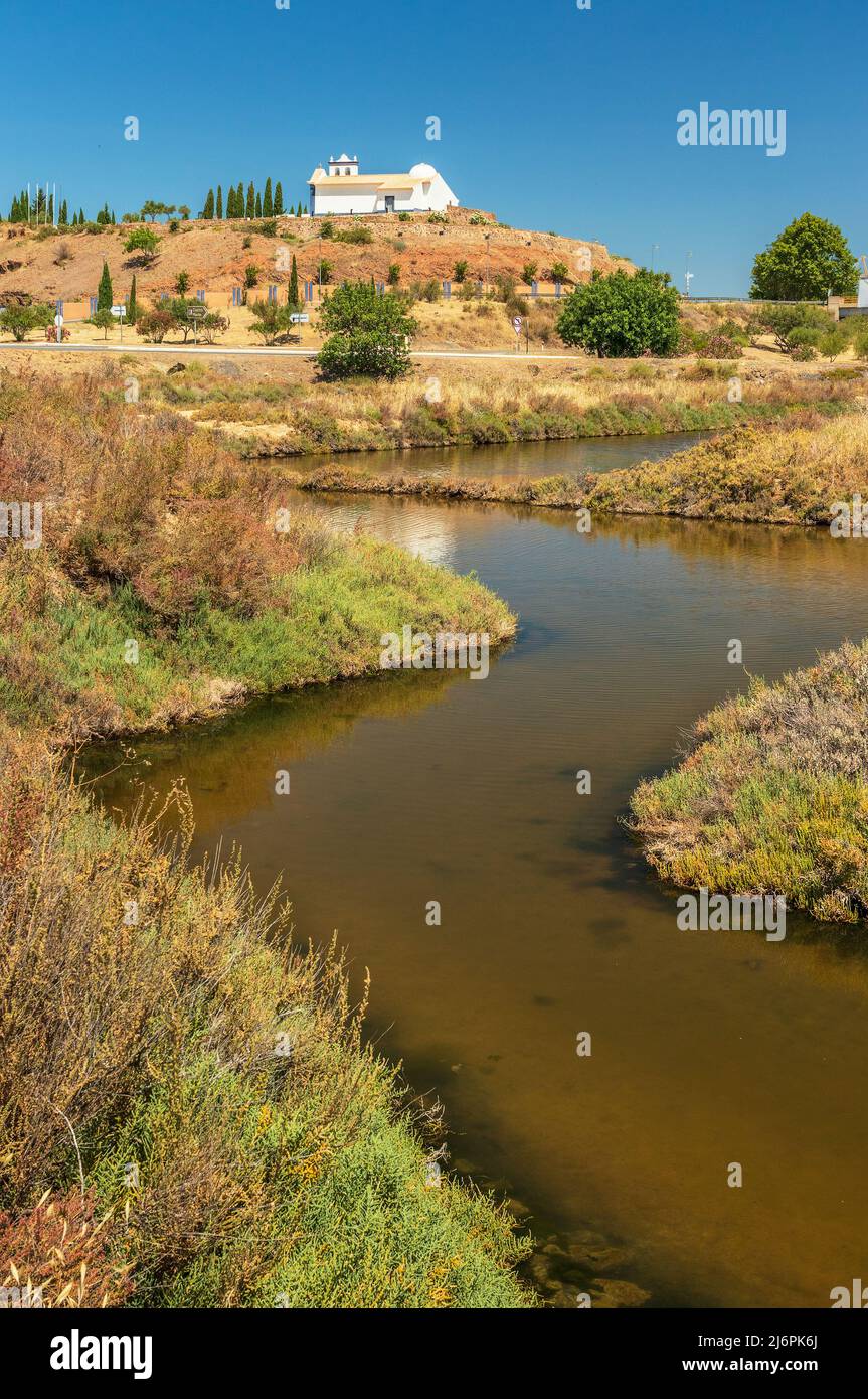 Marsh of Castro Marim and Vila Real de Santo António in Portugal, with the ravelin and the chapel of Santo António in the background, on a sunny day Stock Photo