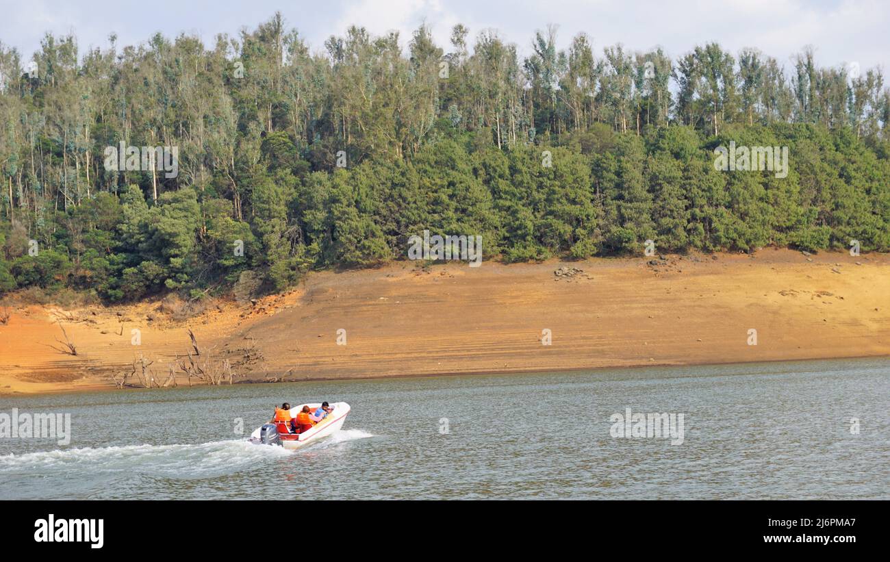 Ooty,Tamilnadu,India-April 30 2022: Tourists enjoying boating ride in beautiful Pykara Lake, Ooty, Tamilnadu. Awesome experience for tourists. Stock Photo