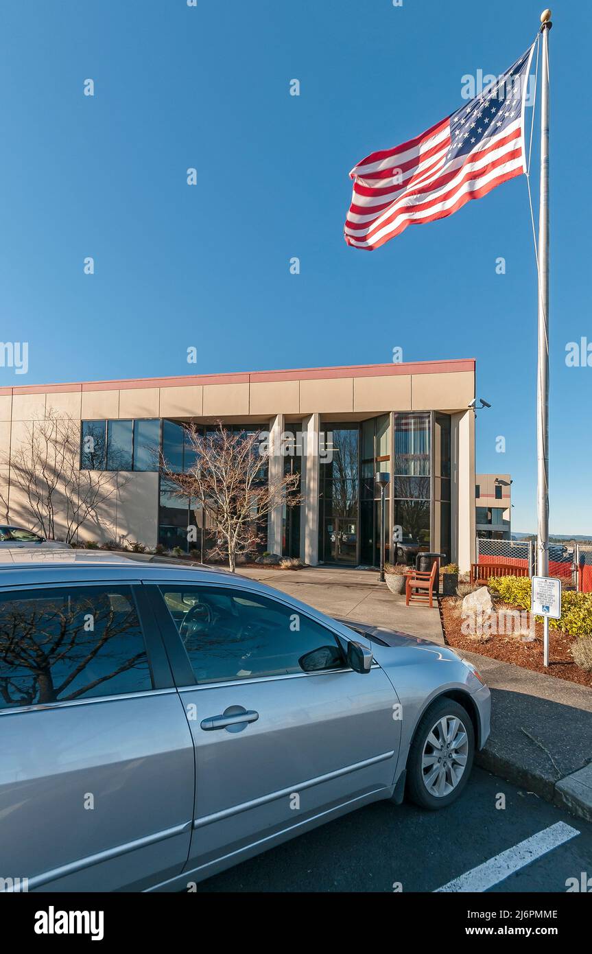 Building with American Flag flying in the wind in Hillsboro, Oregon
